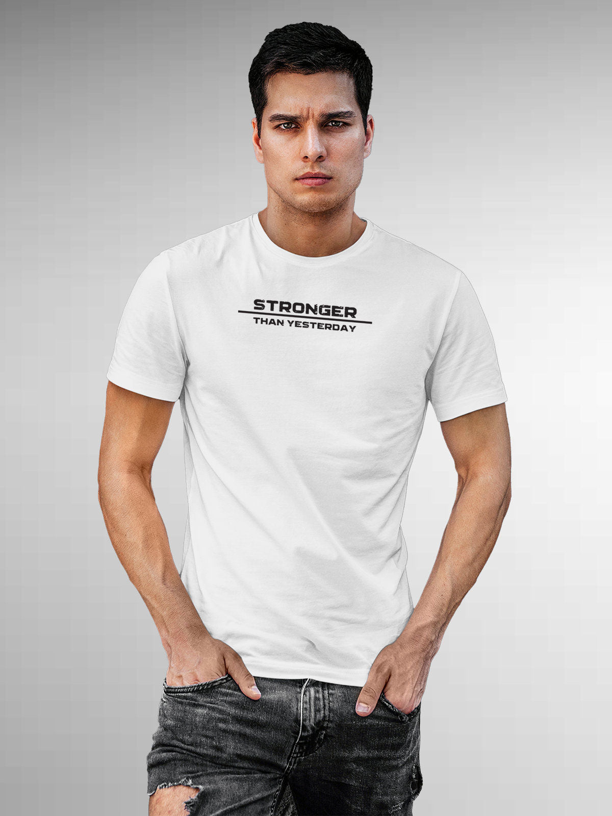 Model wearing Men's White Round Neck T-shirt with 'Stronger Than Yesterday' design, offering effortless style and premium comfort