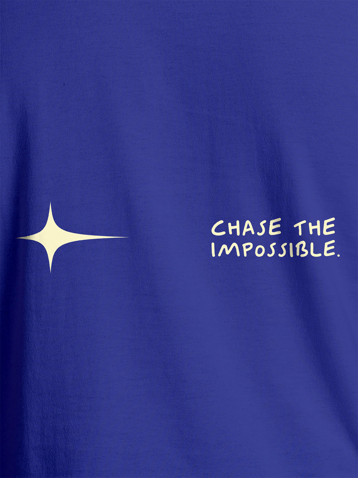 Close up of 'Chase The Impossible' design on Men's Blue Round Neck T-shirt, highlighting intricate details and vibrant print.