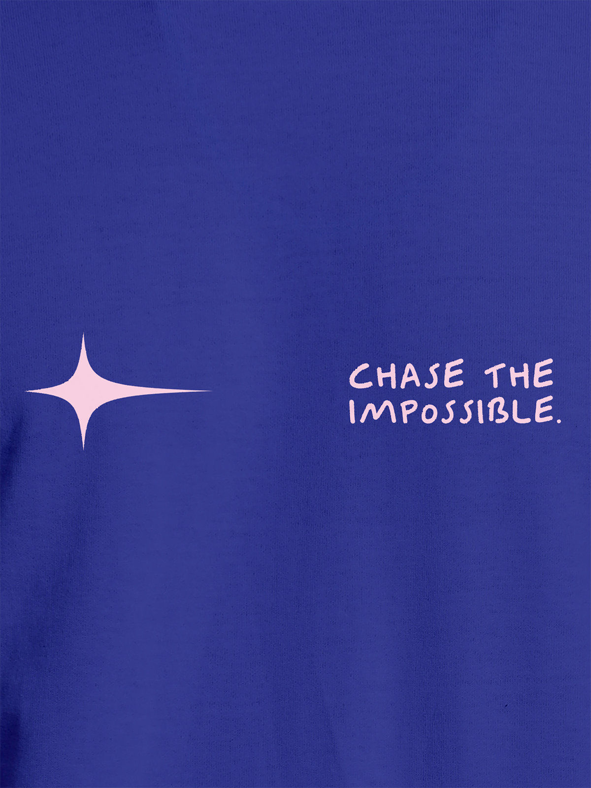 Close up of 'Chase The Impossible' design on Women's Blue Round Neck T-shirt, highlighting intricate details and vibrant print.