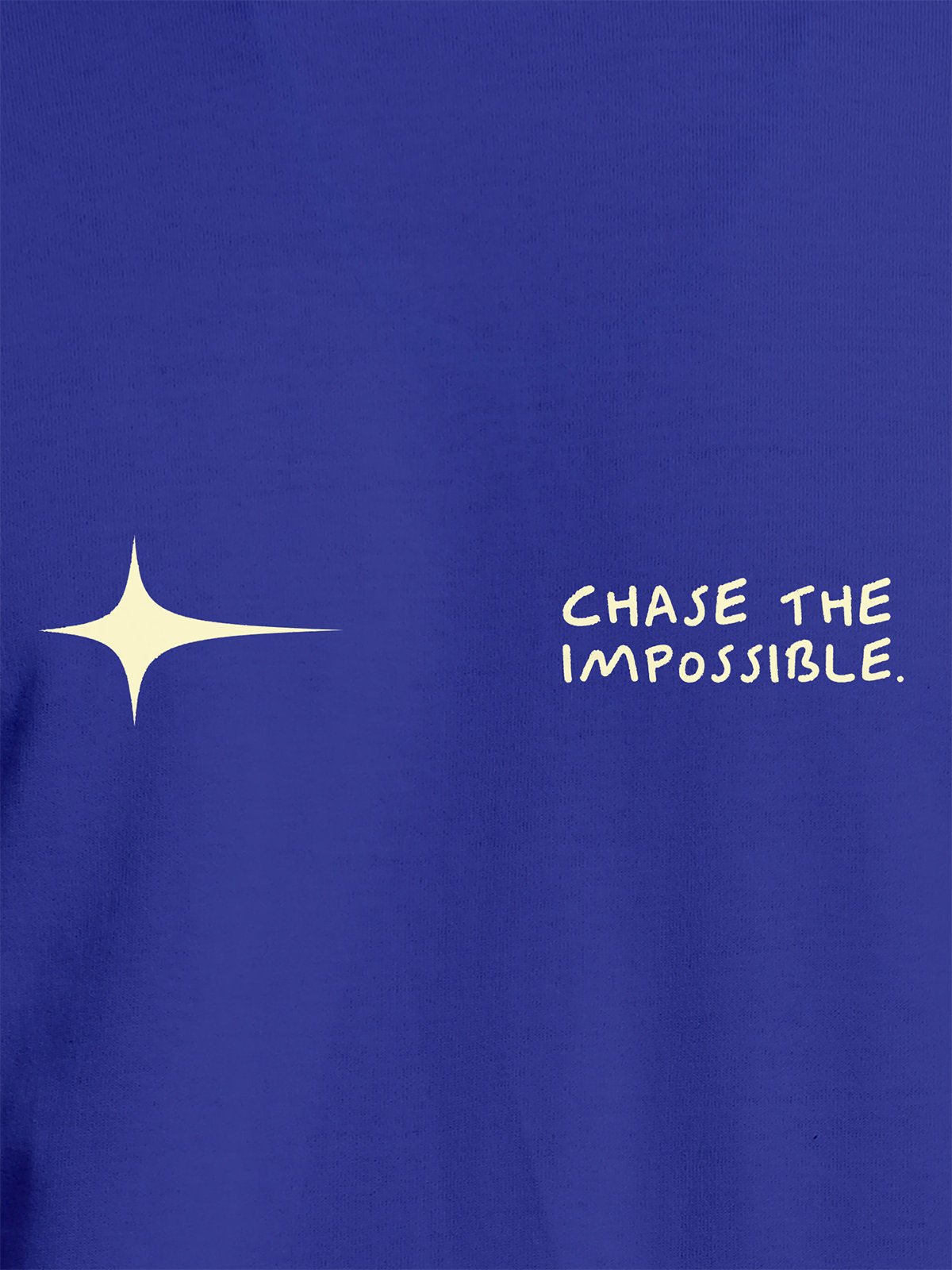 Close up of 'Chase The Impossible' design on Women's Blue Round Neck T-shirt, highlighting intricate details and vibrant print.