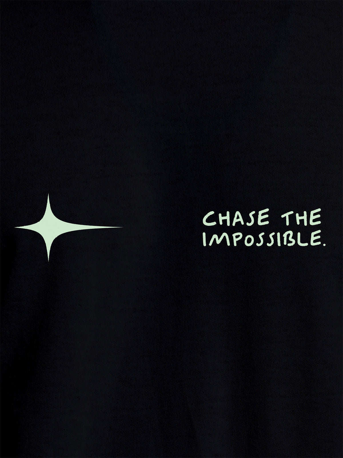 Close up of 'Chase The Impossible' design on Women's Black Round Neck T-shirt, highlighting intricate details and vibrant print.