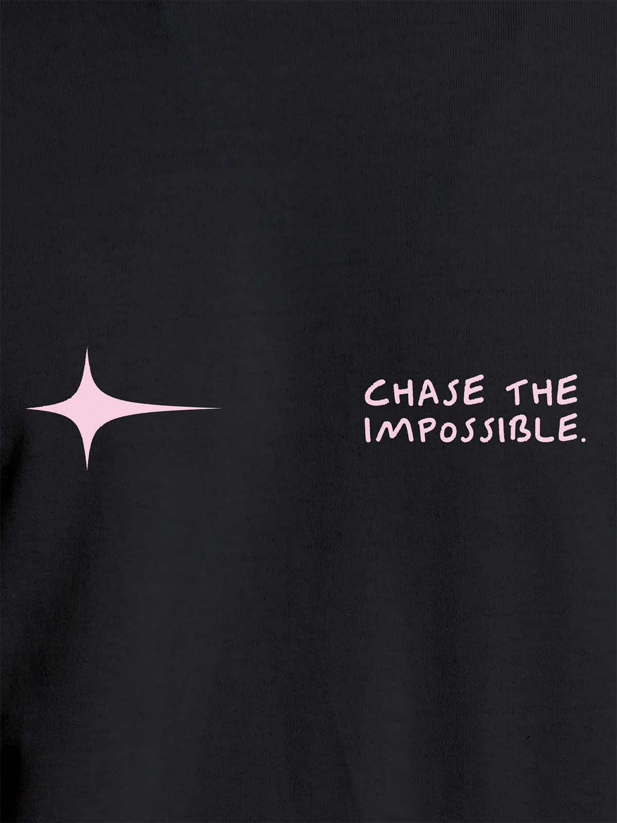 Close up of 'Chase The Impossible' design on Women's Dark Grey Round Neck T-shirt, highlighting intricate details and vibrant print.
