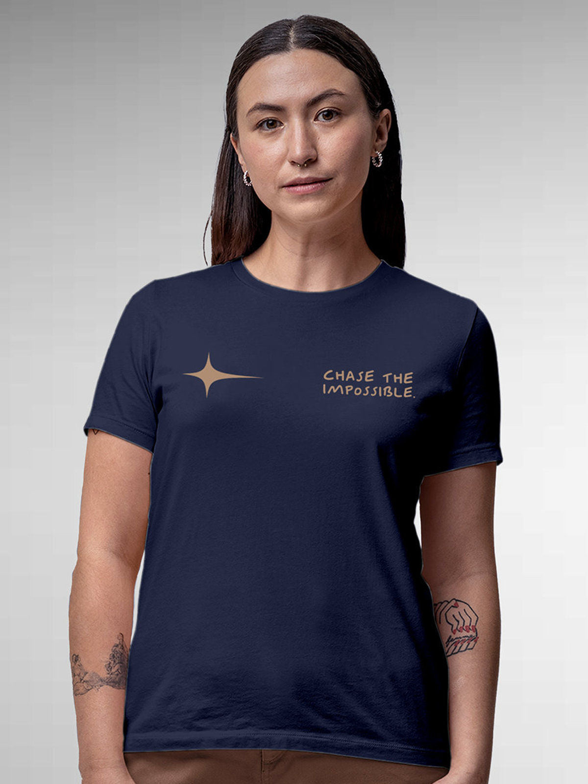 Model wearing Women's Navy Blue Round Neck T-shirt with 'Chase The Impossible' design, offering effortless style and premium comfort