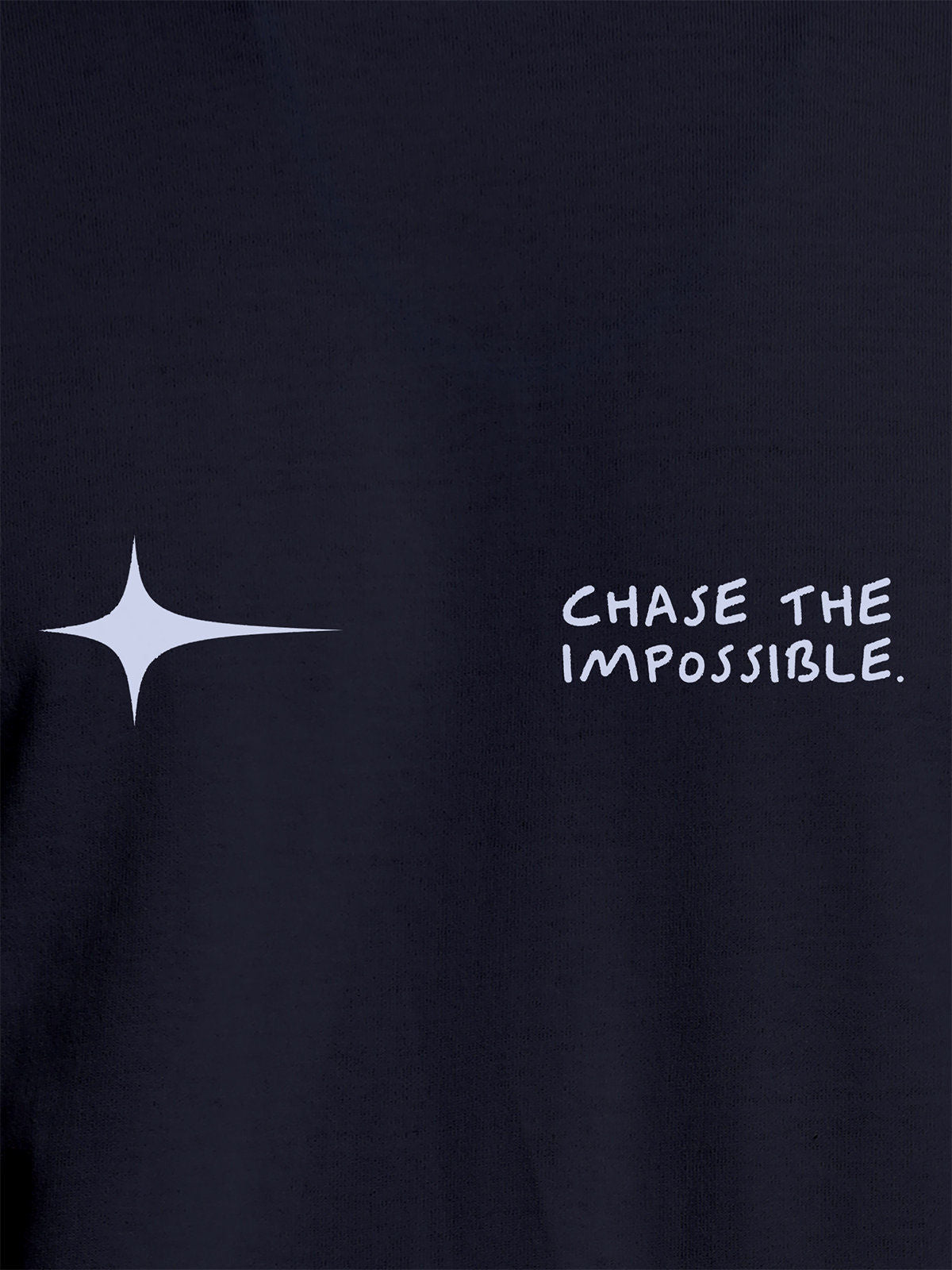 Close up of 'Chase The Impossible' design on Women's Navy Blue Round Neck T-shirt, highlighting intricate details and vibrant print.