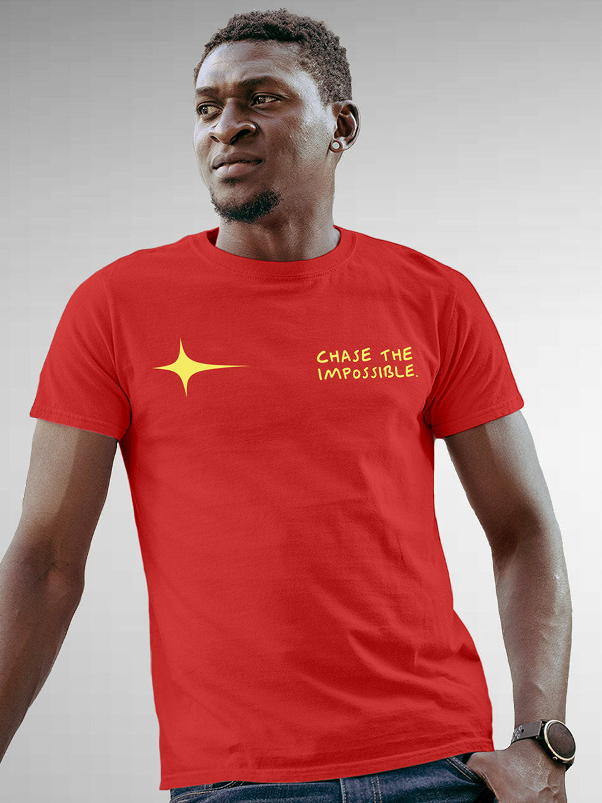 Model wearing Men's Red Round Neck T-shirt with 'Chase The Impossible' design, offering effortless style and premium comfort