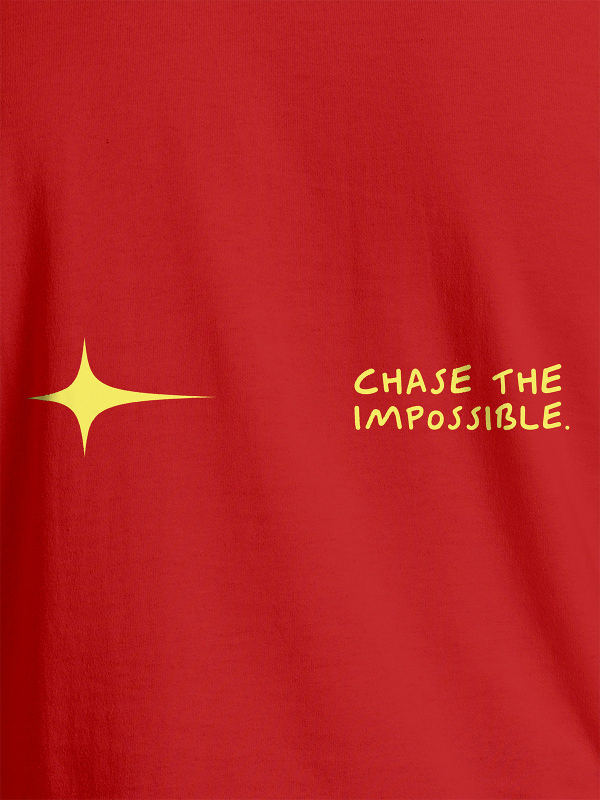 Close up of 'Chase The Impossible' design on Men's Red Round Neck T-shirt, highlighting intricate details and vibrant print.