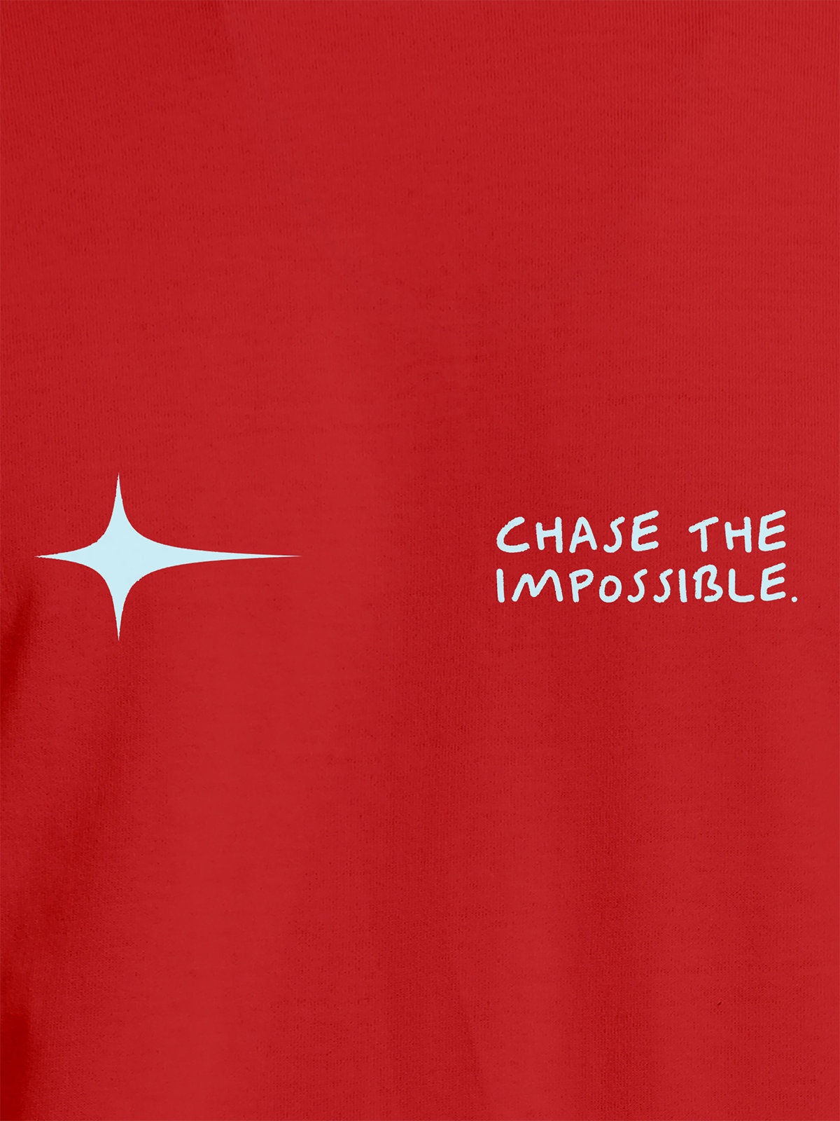 Close up of 'Chase The Impossible' design on Women's Red Round Neck T-shirt, highlighting intricate details and vibrant print.