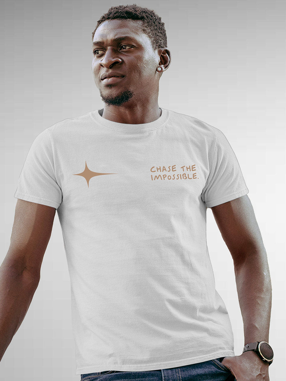 Model wearing Men's White Round Neck T-shirt with 'Chase The Impossible' design, offering effortless style and premium comfort