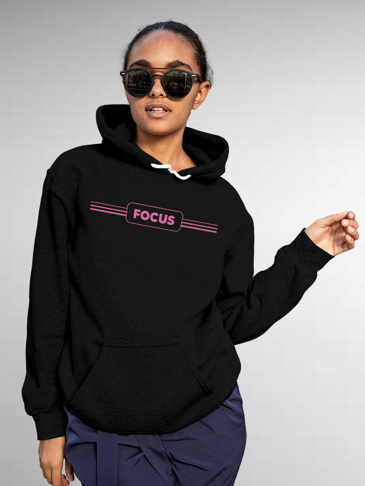 Model wearing Women's Black Hoodie Sweatshirt with 'Focus' design, offering effortless style and premium comfort