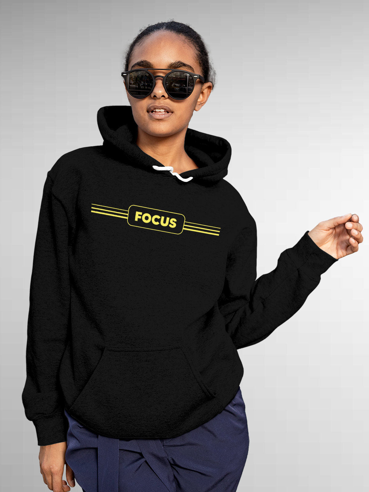 Model wearing Women's Black Hoodie Sweatshirt with 'Focus' design, offering effortless style and premium comfort