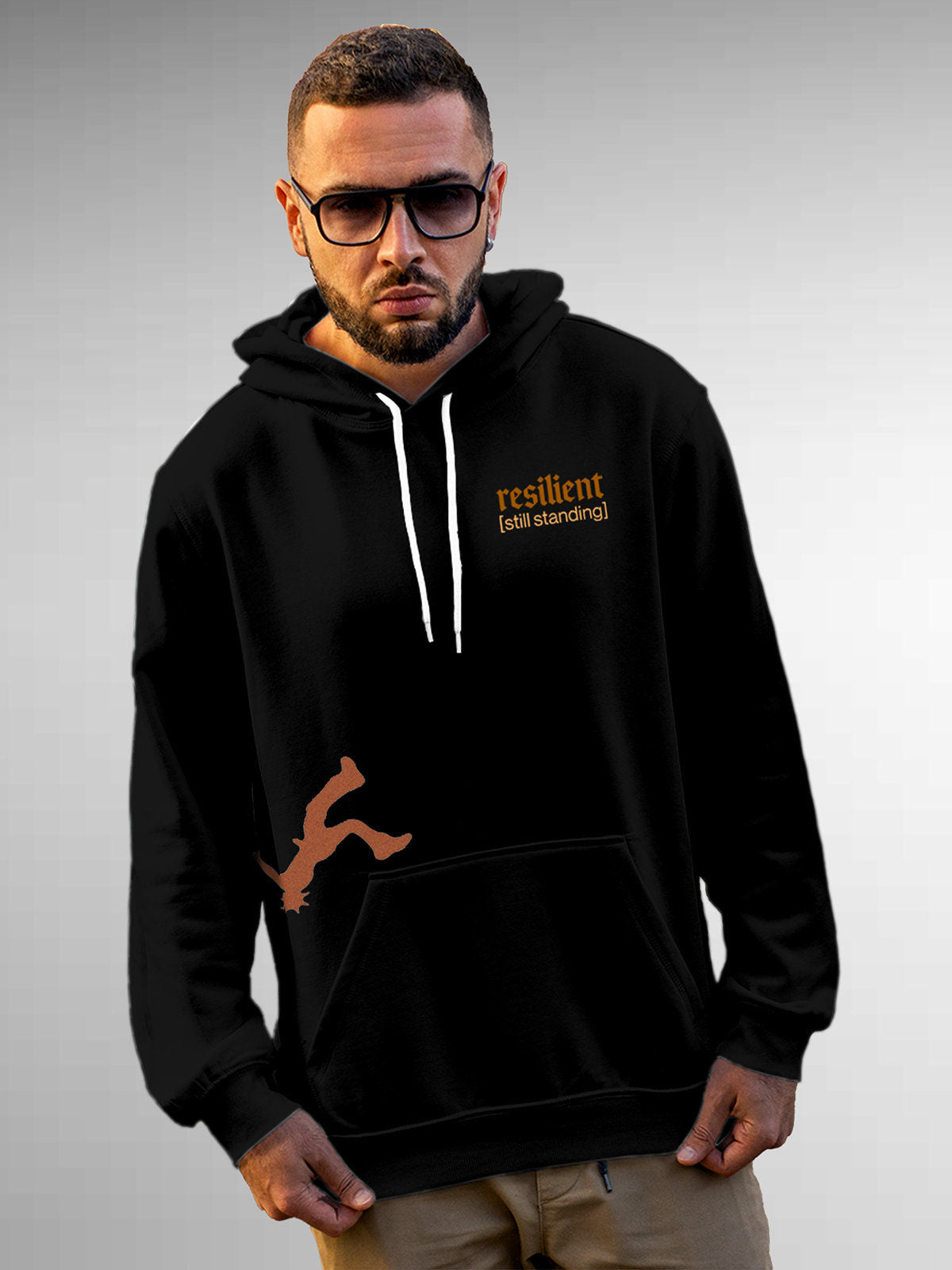 Model wearing Men's Black Hoodie Sweatshirt with 'Resilient' design, offering effortless style and premium comfort