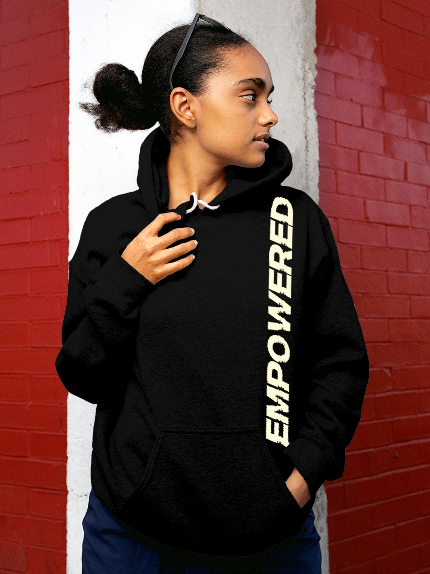 Model wearing Women's Black Hoodie Sweatshirt with 'Empowered' design, offering effortless style and premium comfort