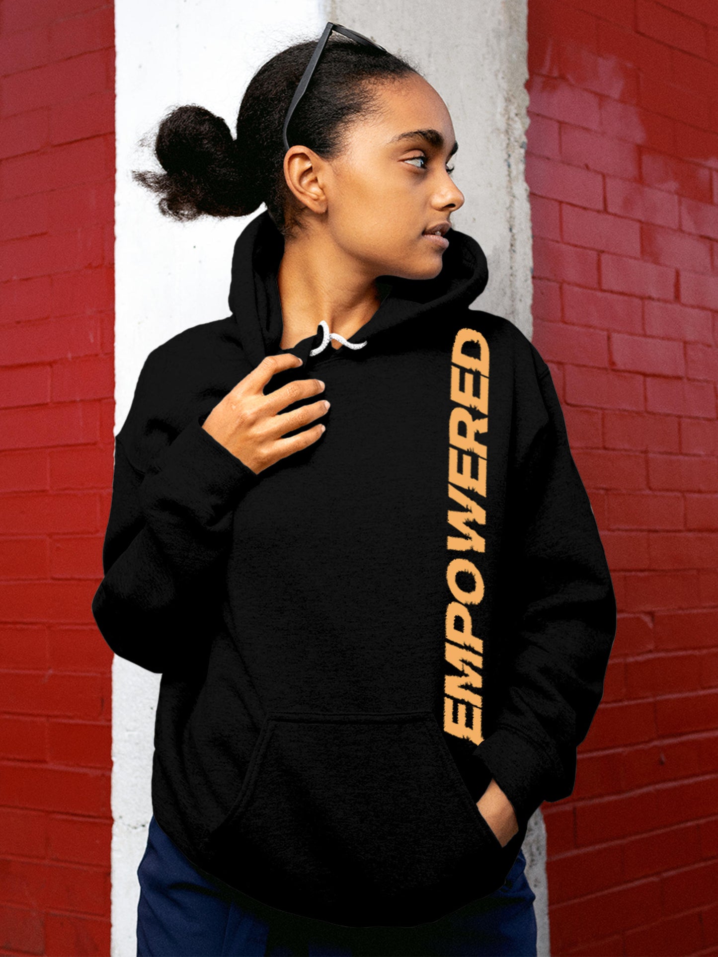 Model wearing Women's Black Hoodie Sweatshirt with 'Empowered' design, offering effortless style and premium comfort