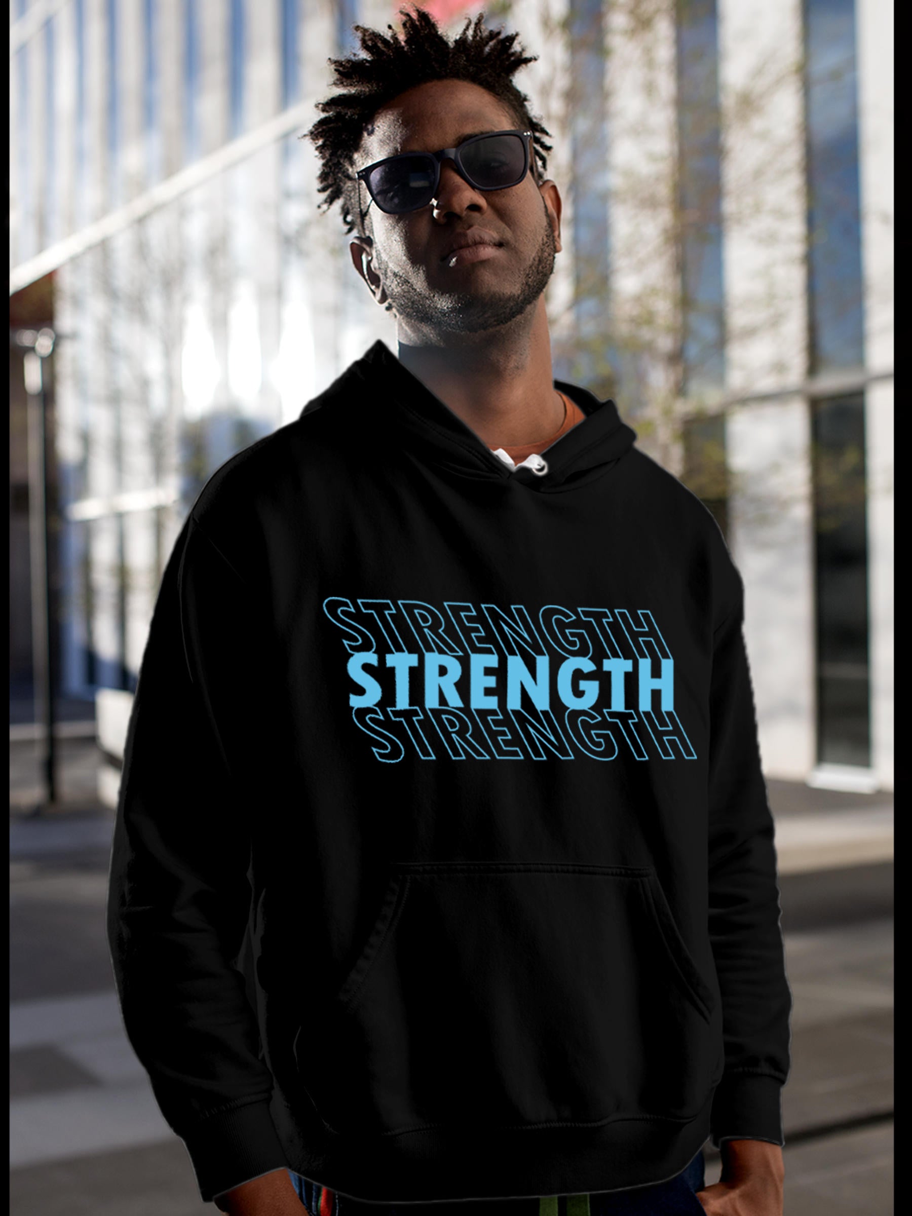 Model wearing Men's Black Hoodie Sweatshirt with 'Strength' design, offering effortless style and premium comfort
