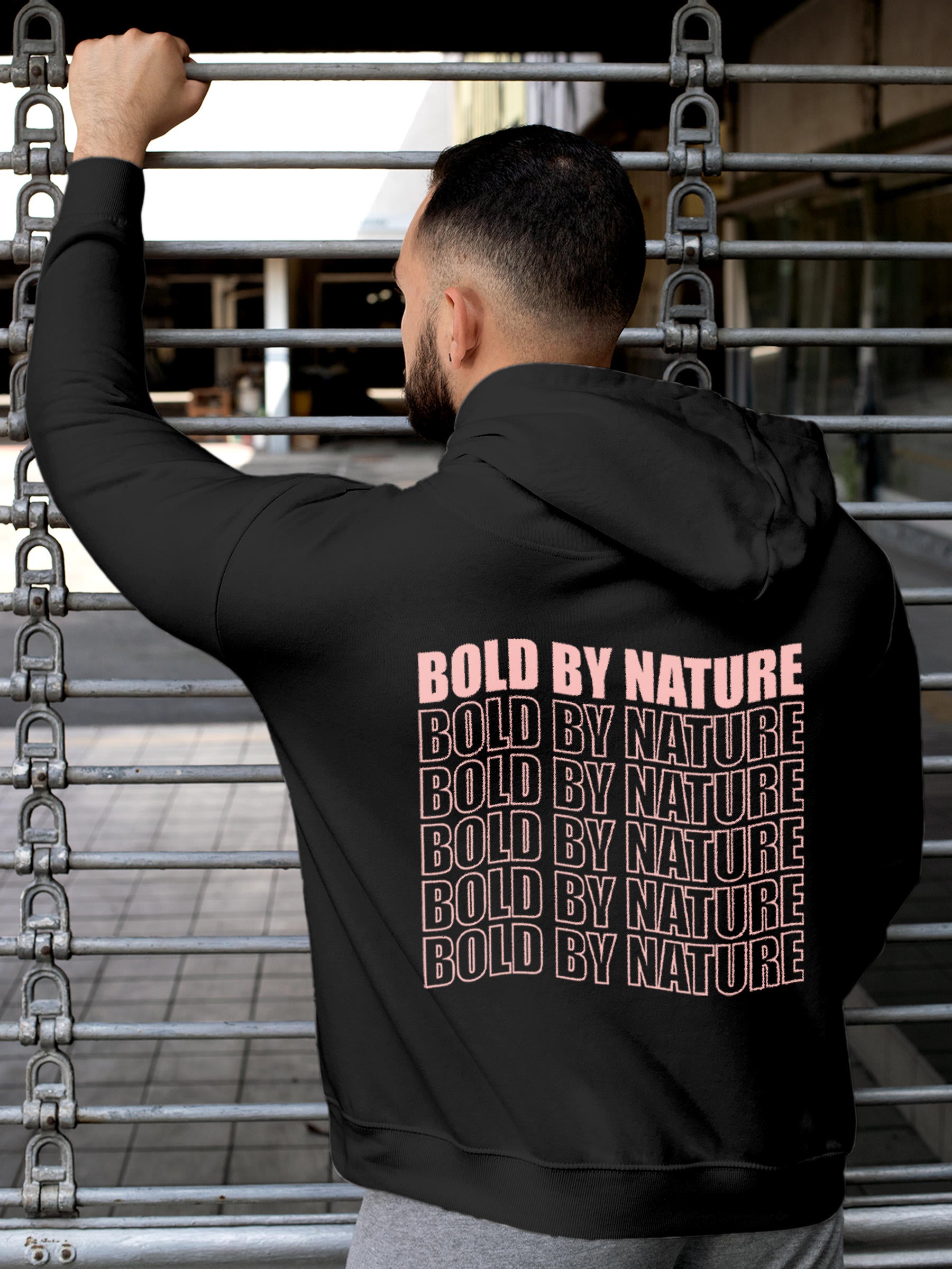 Model wearing Men's Dark Grey Hoodie Sweatshirt with 'Bold By Nature' design, offering effortless style and premium comfort
