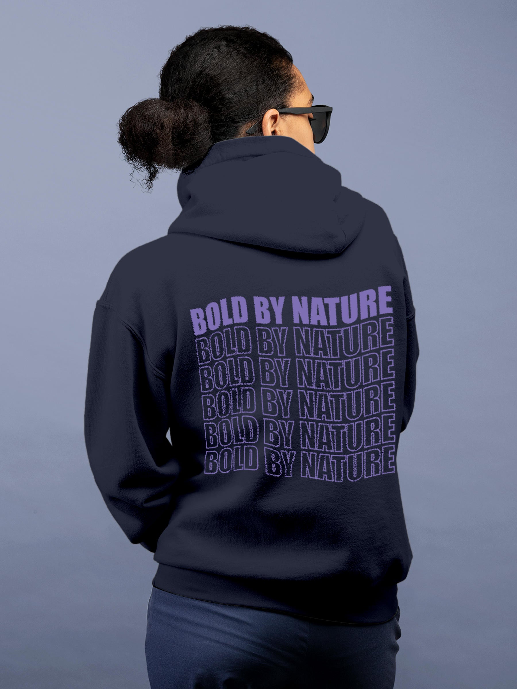 Model wearing Women's Navy Blue Hoodie Sweatshirt with 'Bold By Nature' design, offering effortless style and premium comfort