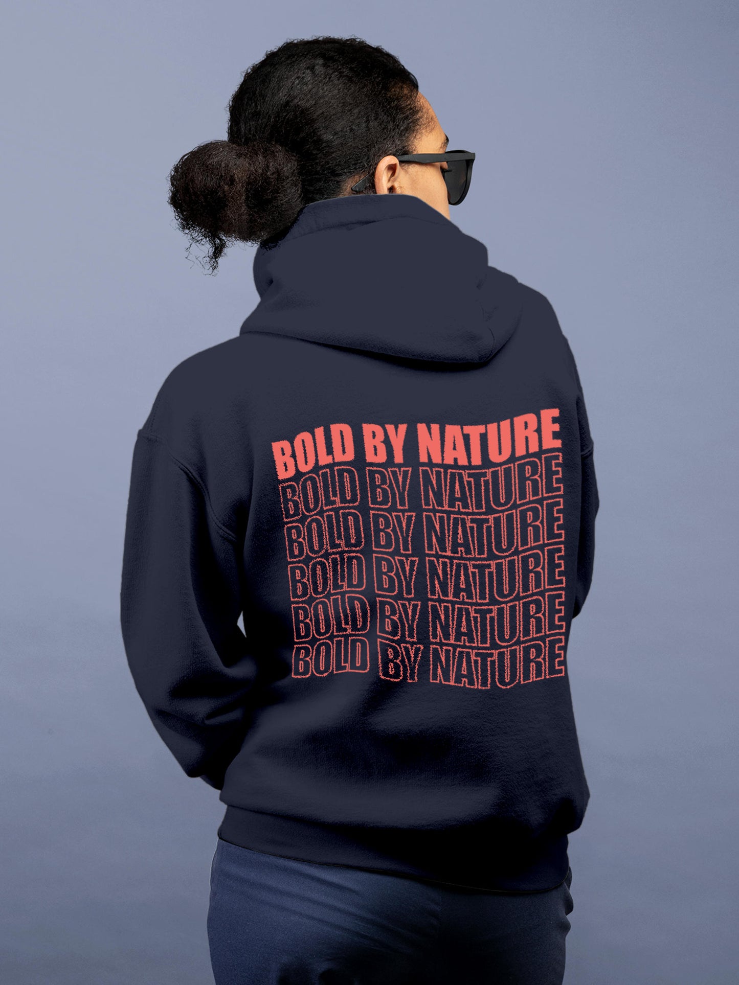 Model wearing Women's Navy Blue Hoodie Sweatshirt with 'Bold By Nature' design, offering effortless style and premium comfort
