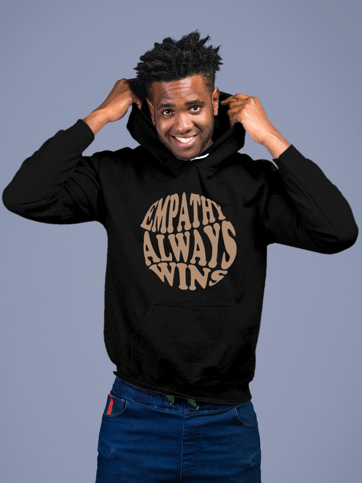 Model wearing Men's Black Hoodie Sweatshirt with 'Empathy Always Wins' design, offering effortless style and premium comfort