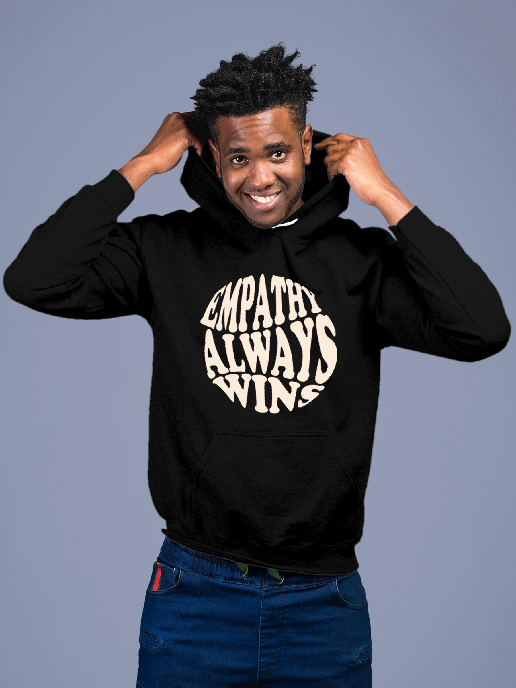 Model wearing Men's Black Hoodie Sweatshirt with 'Empathy Always Wins' design, offering effortless style and premium comfort