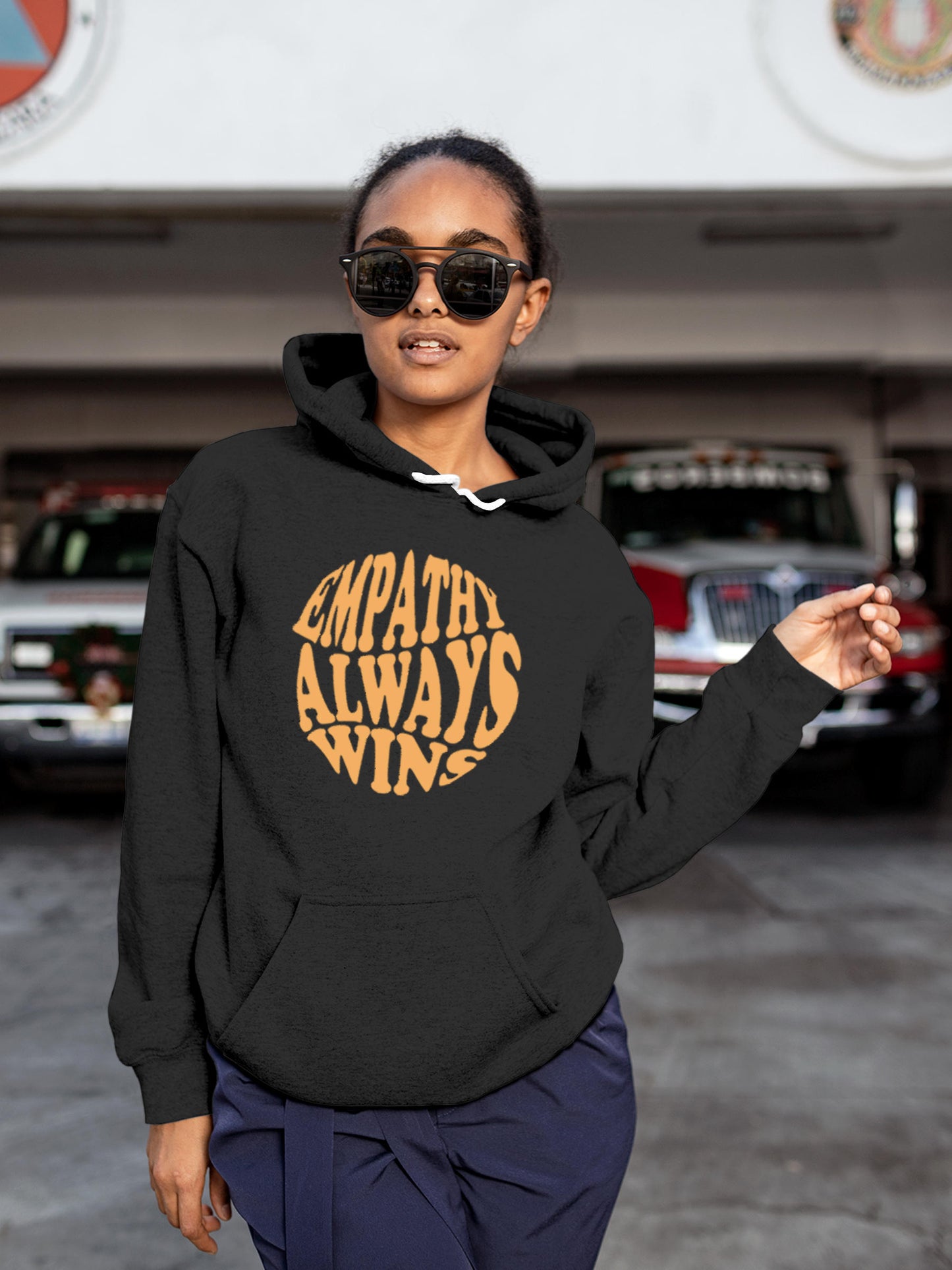Model wearing Women's Dark Grey Hoodie Sweatshirt with 'Empathy Always Wins' design, offering effortless style and premium comfort