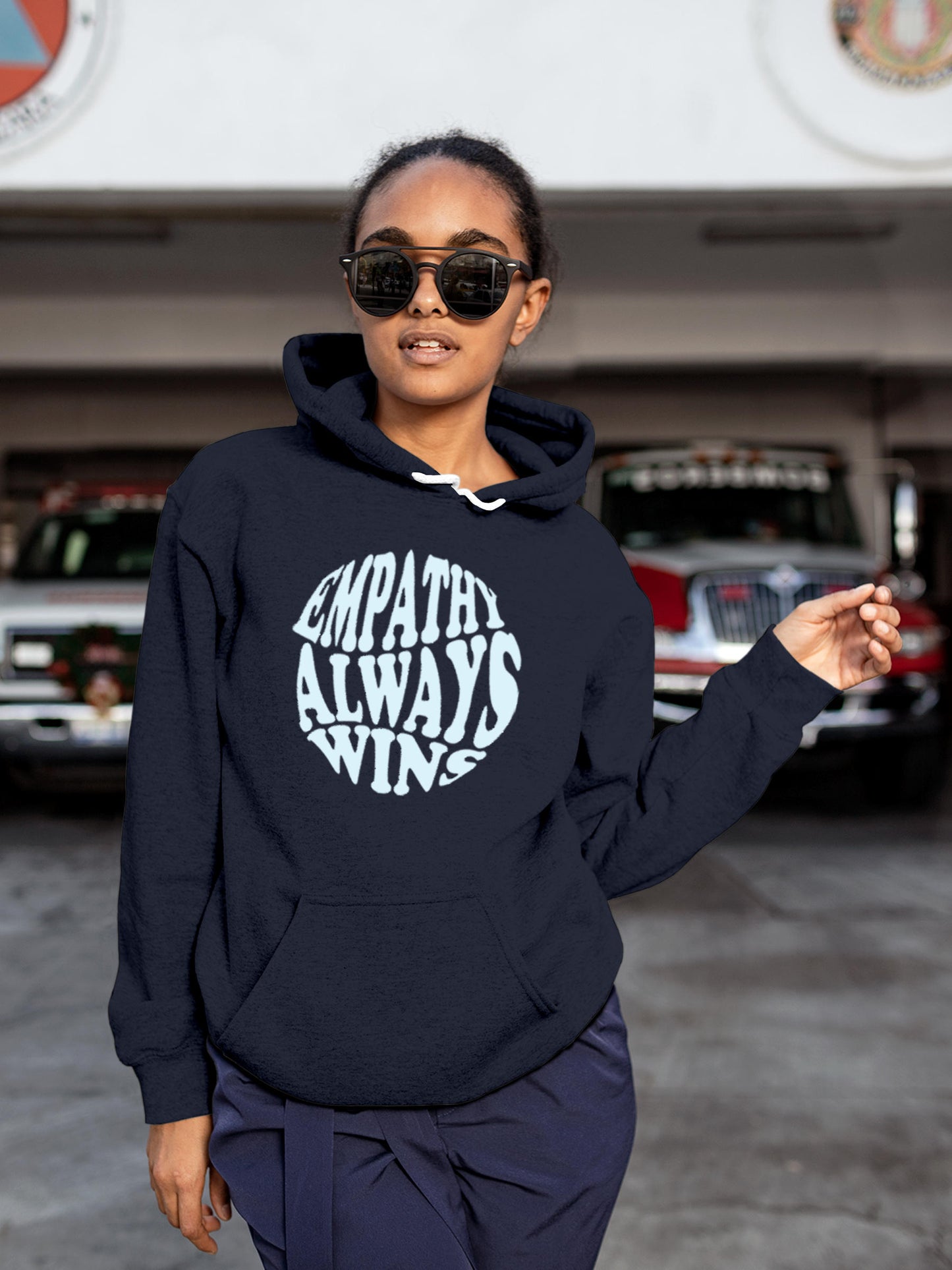 Model wearing Women's Navy Blue Hoodie Sweatshirt with 'Empathy Always Wins' design, offering effortless style and premium comfort