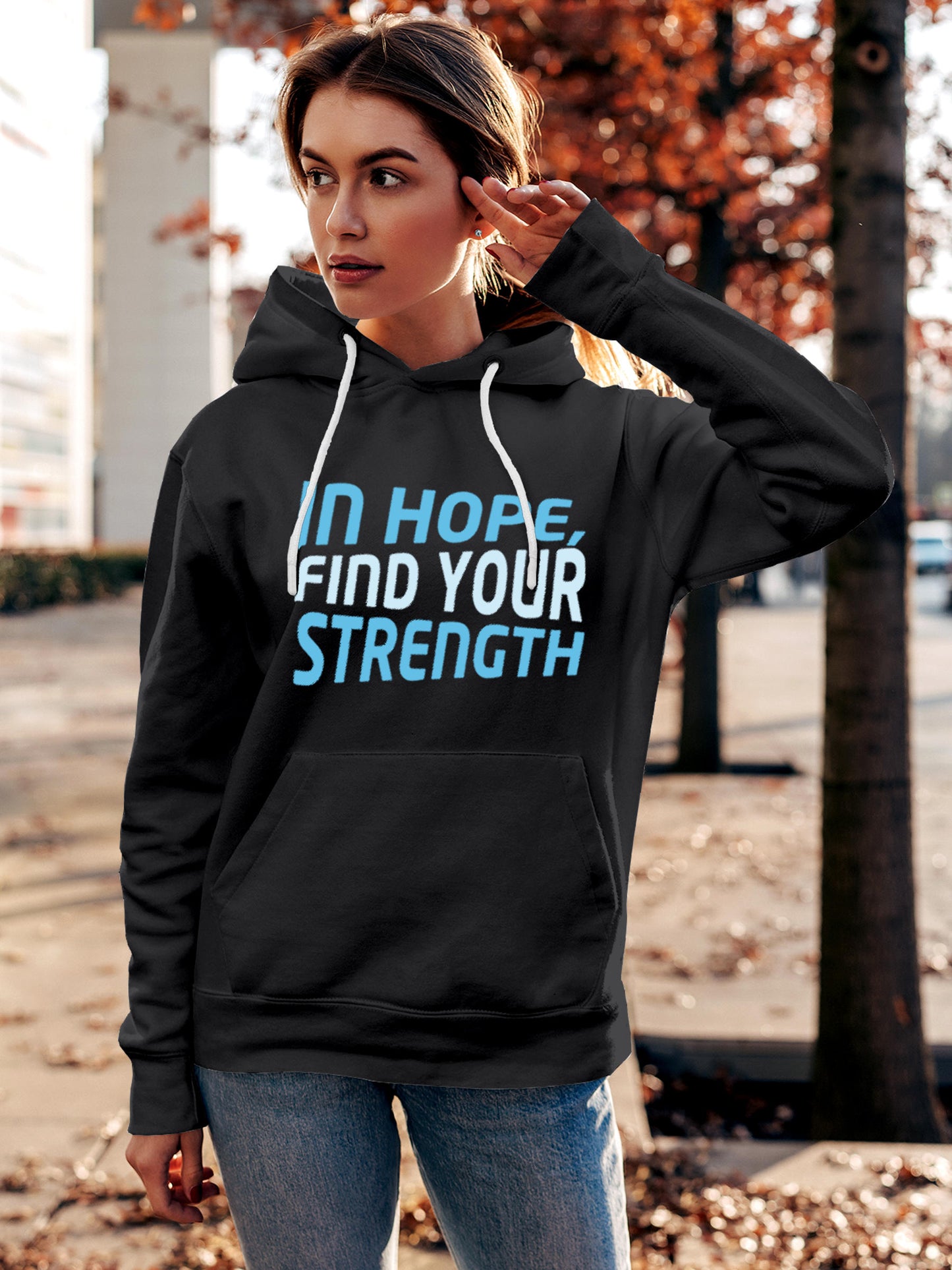 Model wearing Women's Dark Grey Hoodie Sweatshirt with 'In Hope, Find Your Strength' design, offering effortless style and premium comfort