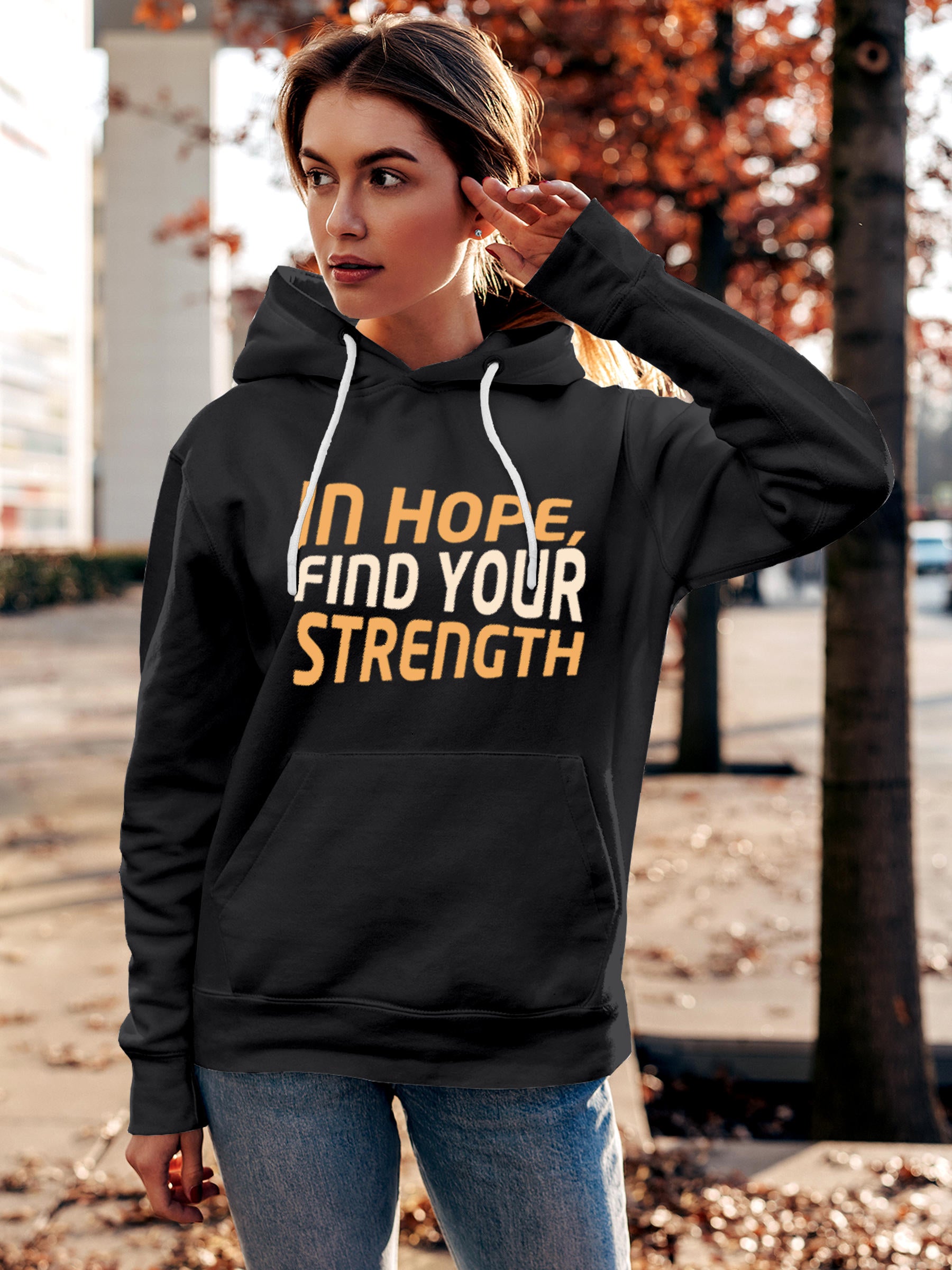 Model wearing Women's Dark Grey Hoodie Sweatshirt with 'In Hope, Find Your Strength' design, offering effortless style and premium comfort