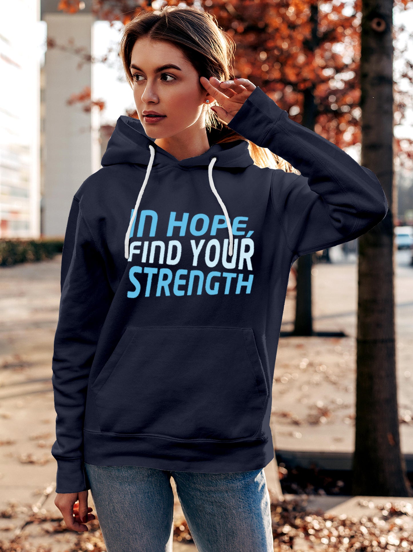 Model wearing Women's Navy Blue Hoodie Sweatshirt with 'In Hope, Find Your Strength' design, offering effortless style and premium comfort