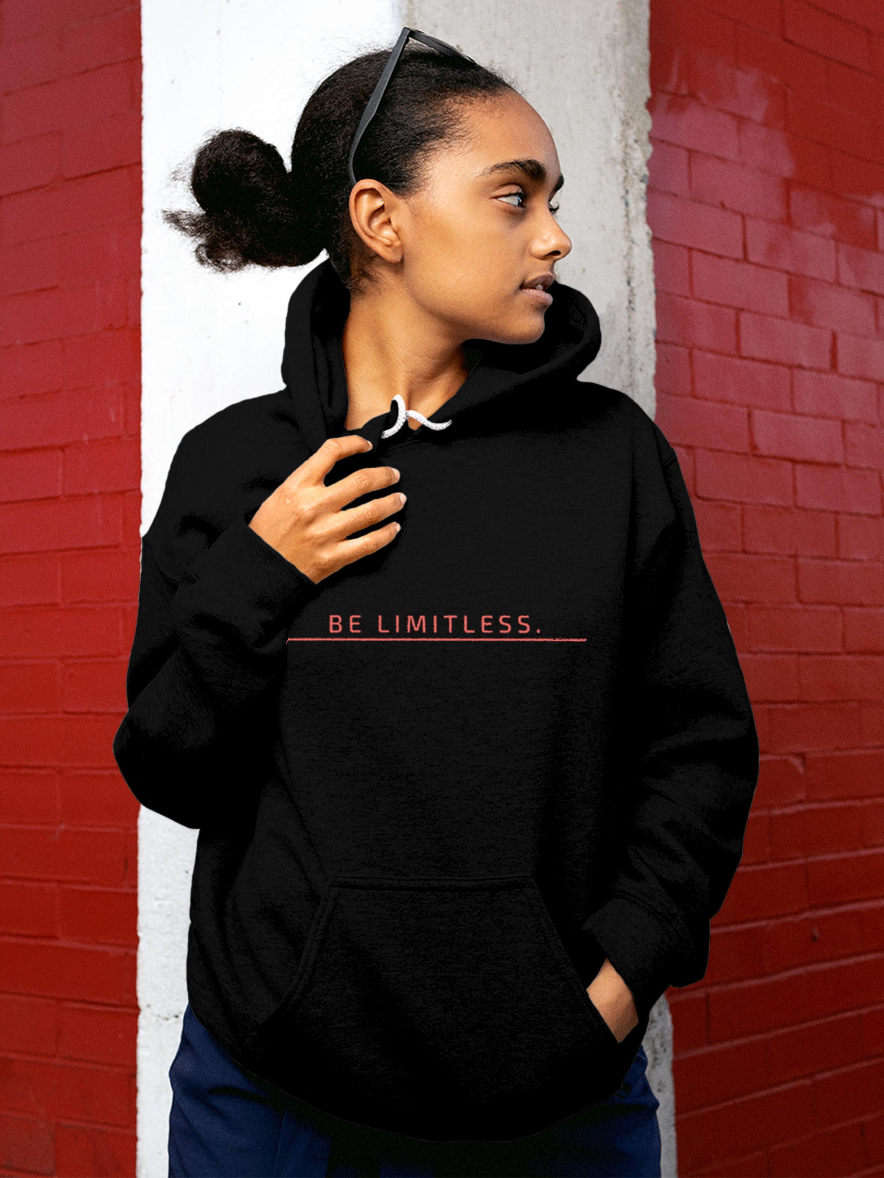 Model wearing Women's Black Hoodie Sweatshirt with 'Be Limitless' design, offering effortless style and premium comfort