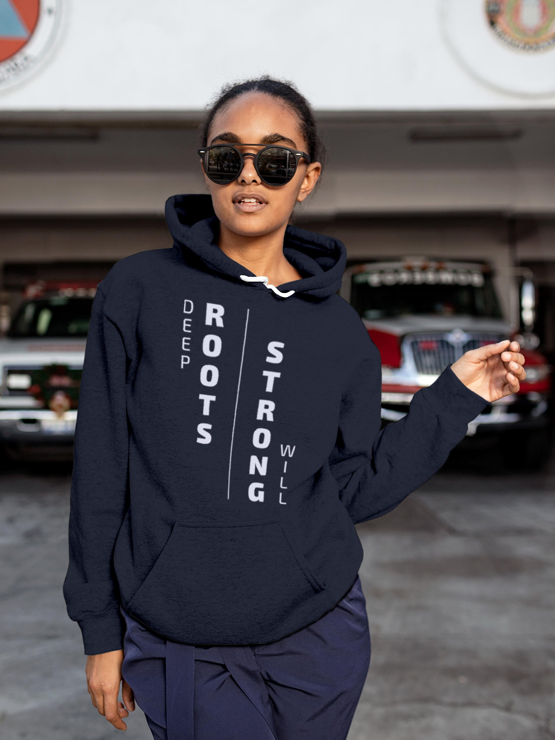 Model wearing Women's Navy Blue Hoodie Sweatshirt with 'Deep Roots Strong Will' design, offering effortless style and premium comfort