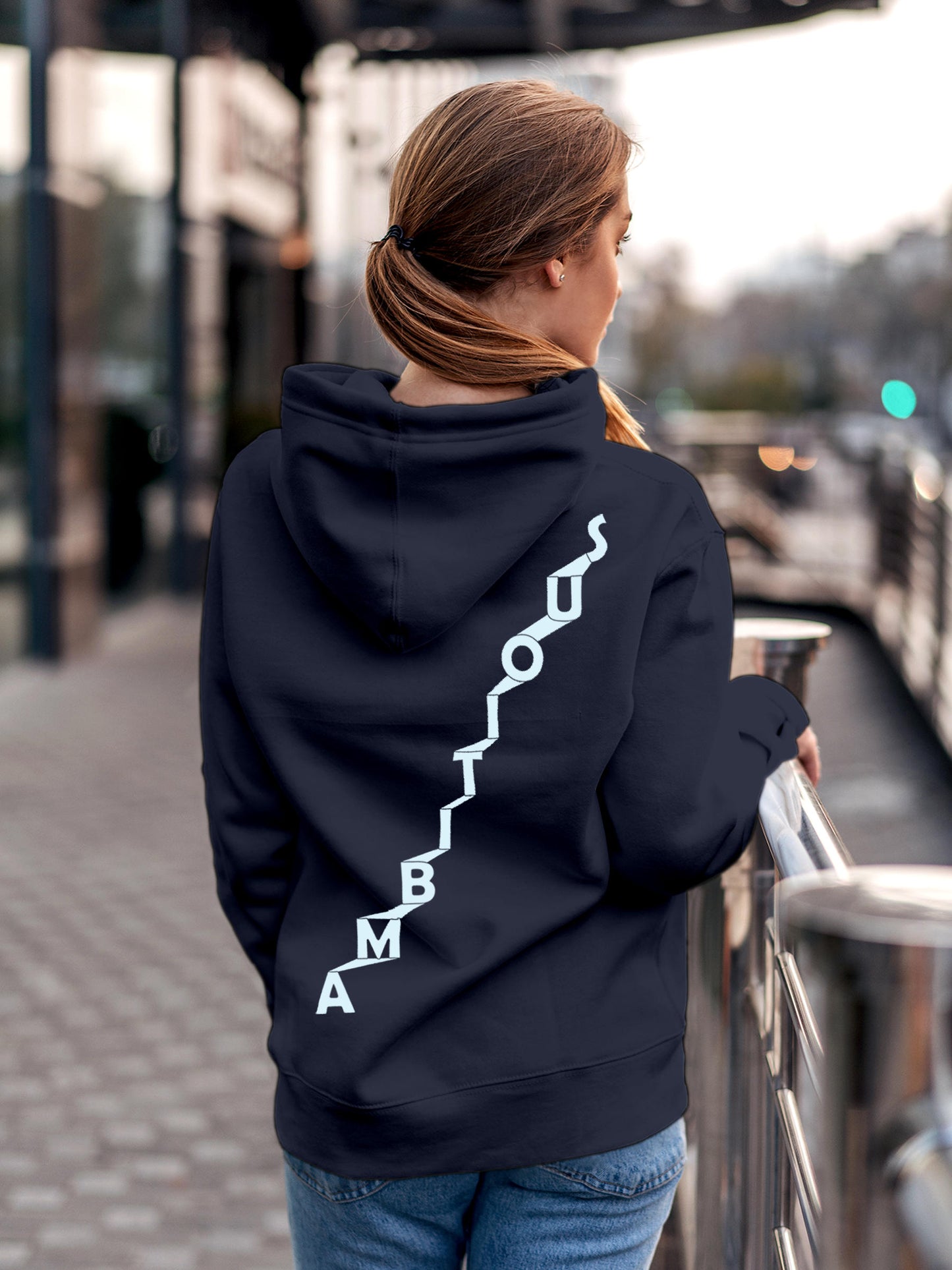 Model wearing Women's Navy Blue Hoodie Sweatshirt with 'Ambitious' design, offering effortless style and premium comfort