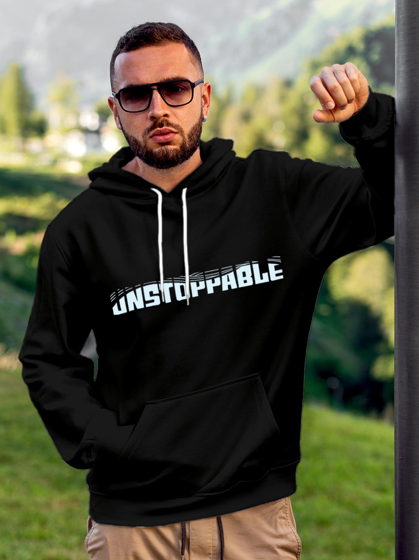 Model wearing Men's Black Hoodie Sweatshirt with 'Unstoppable' design, offering effortless style and premium comfort