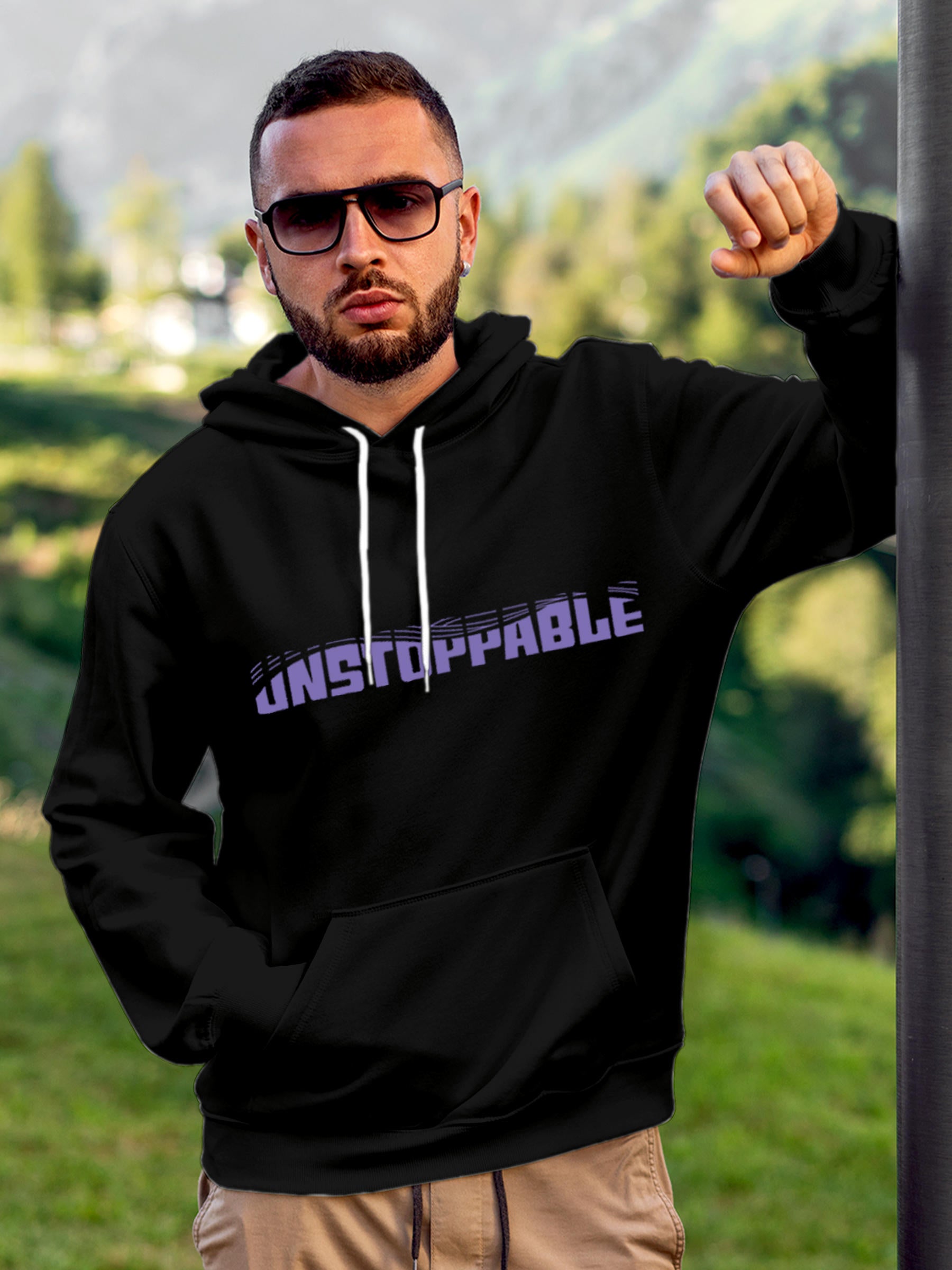 Model wearing Men's Black Hoodie Sweatshirt with 'Unstoppable' design, offering effortless style and premium comfort