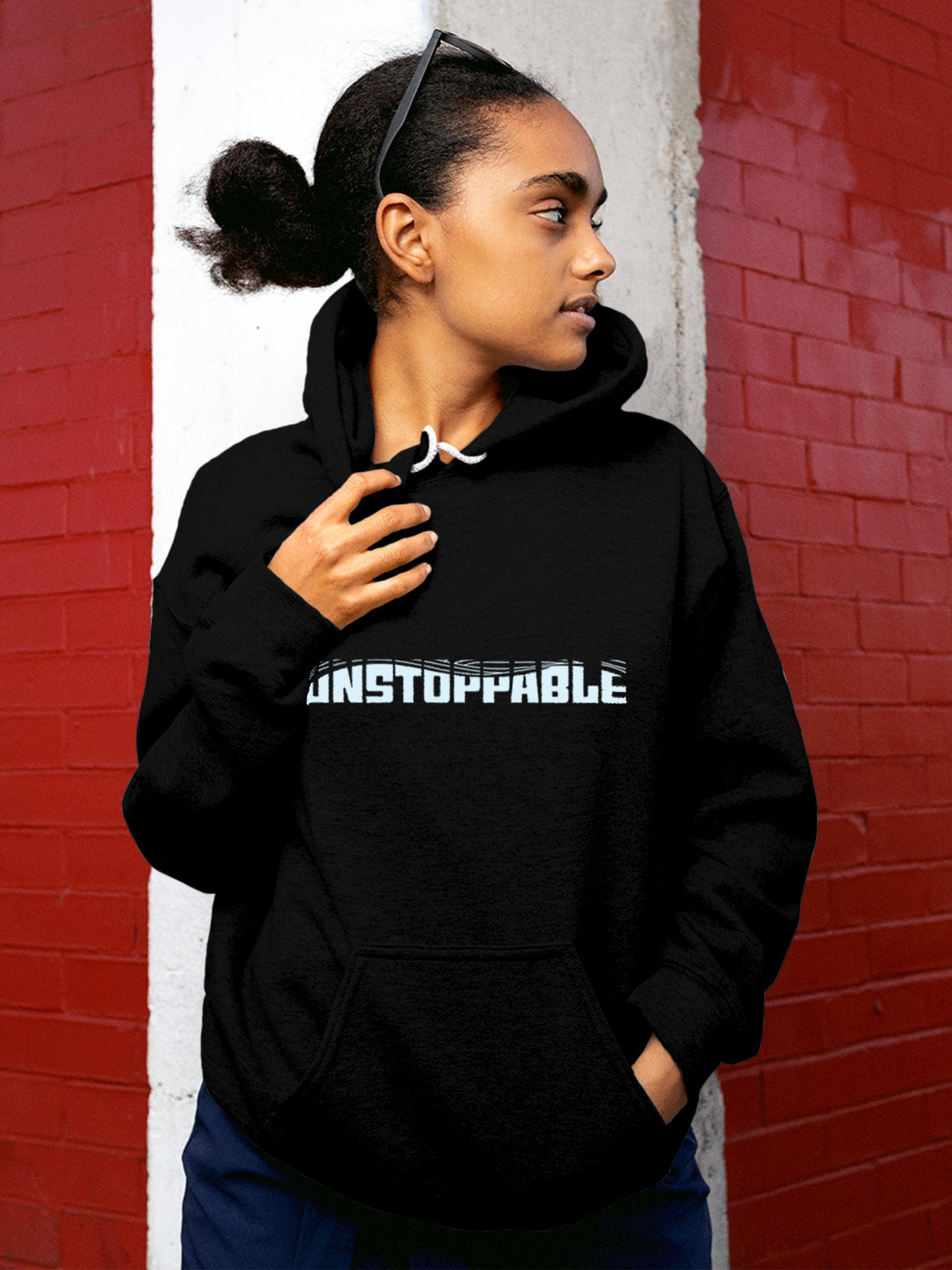 Model wearing Women's Black Hoodie Sweatshirt with 'Unstoppable' design, offering effortless style and premium comfort