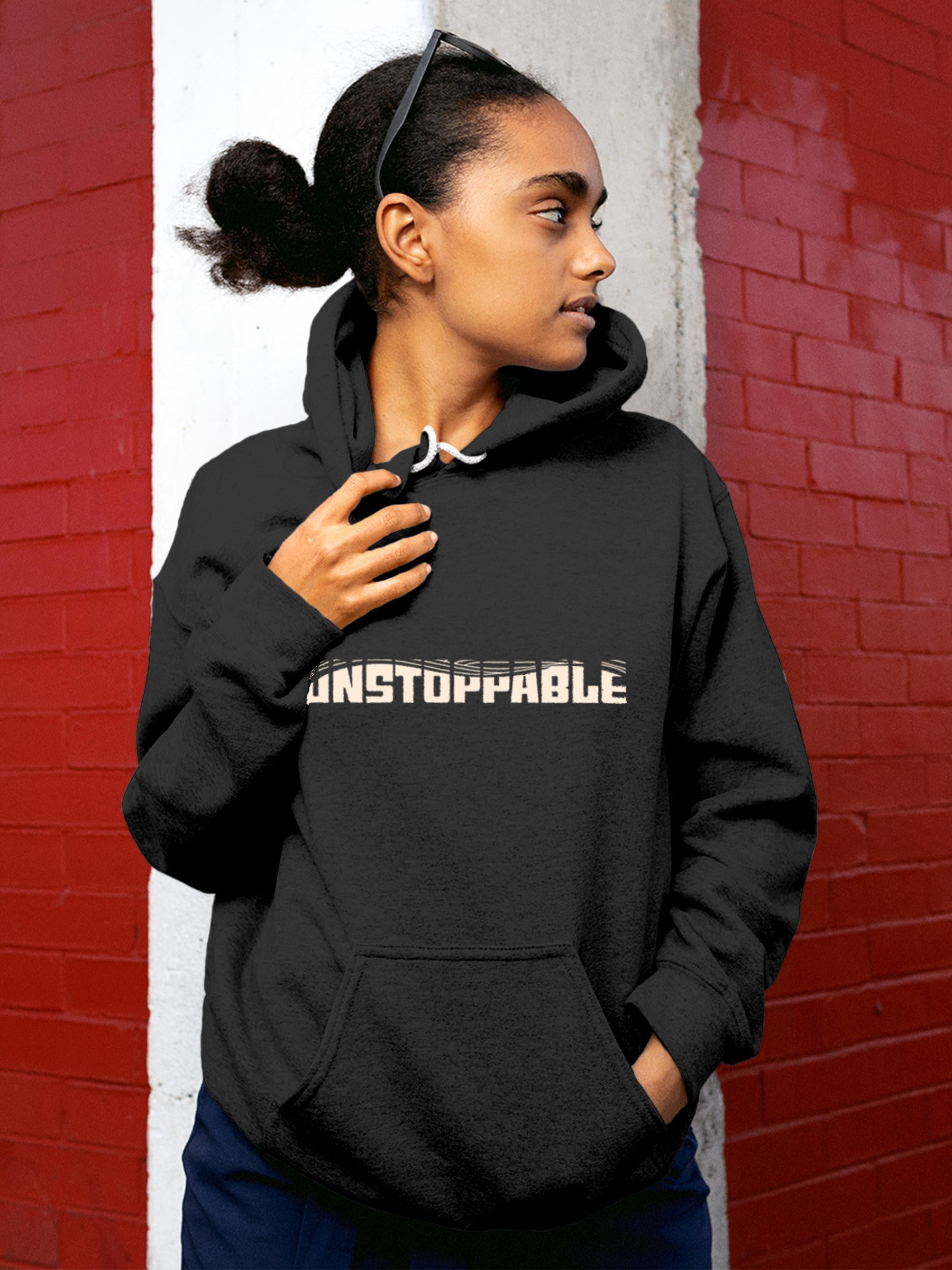 Model wearing Women's Dark Grey Hoodie Sweatshirt with 'Unstoppable' design, offering effortless style and premium comfort