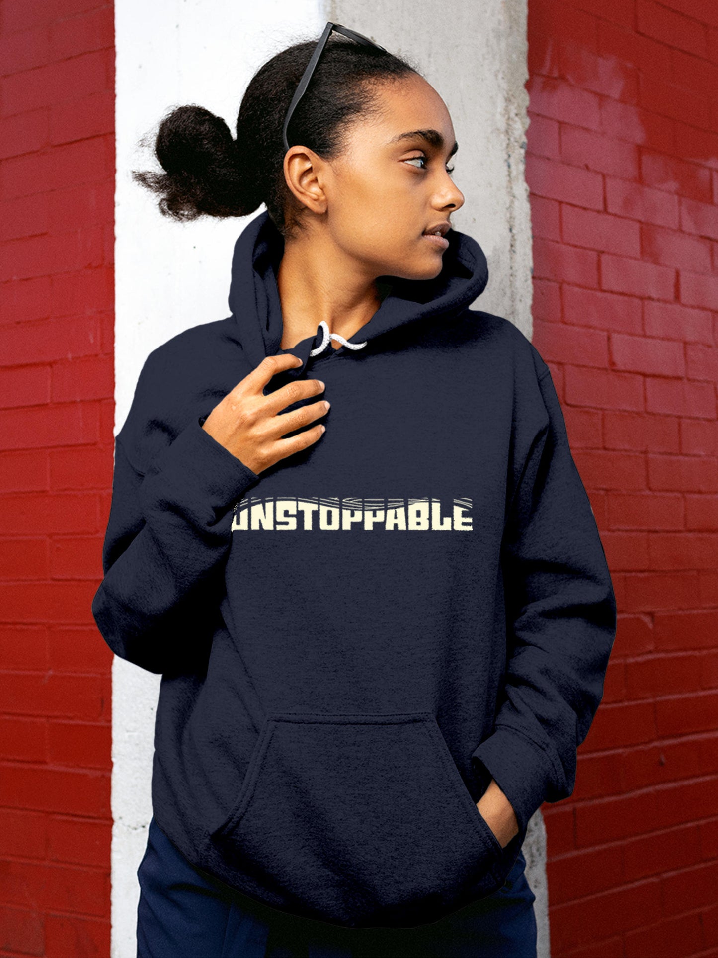 Model wearing Women's Navy Blue Hoodie Sweatshirt with 'Unstoppable' design, offering effortless style and premium comfort