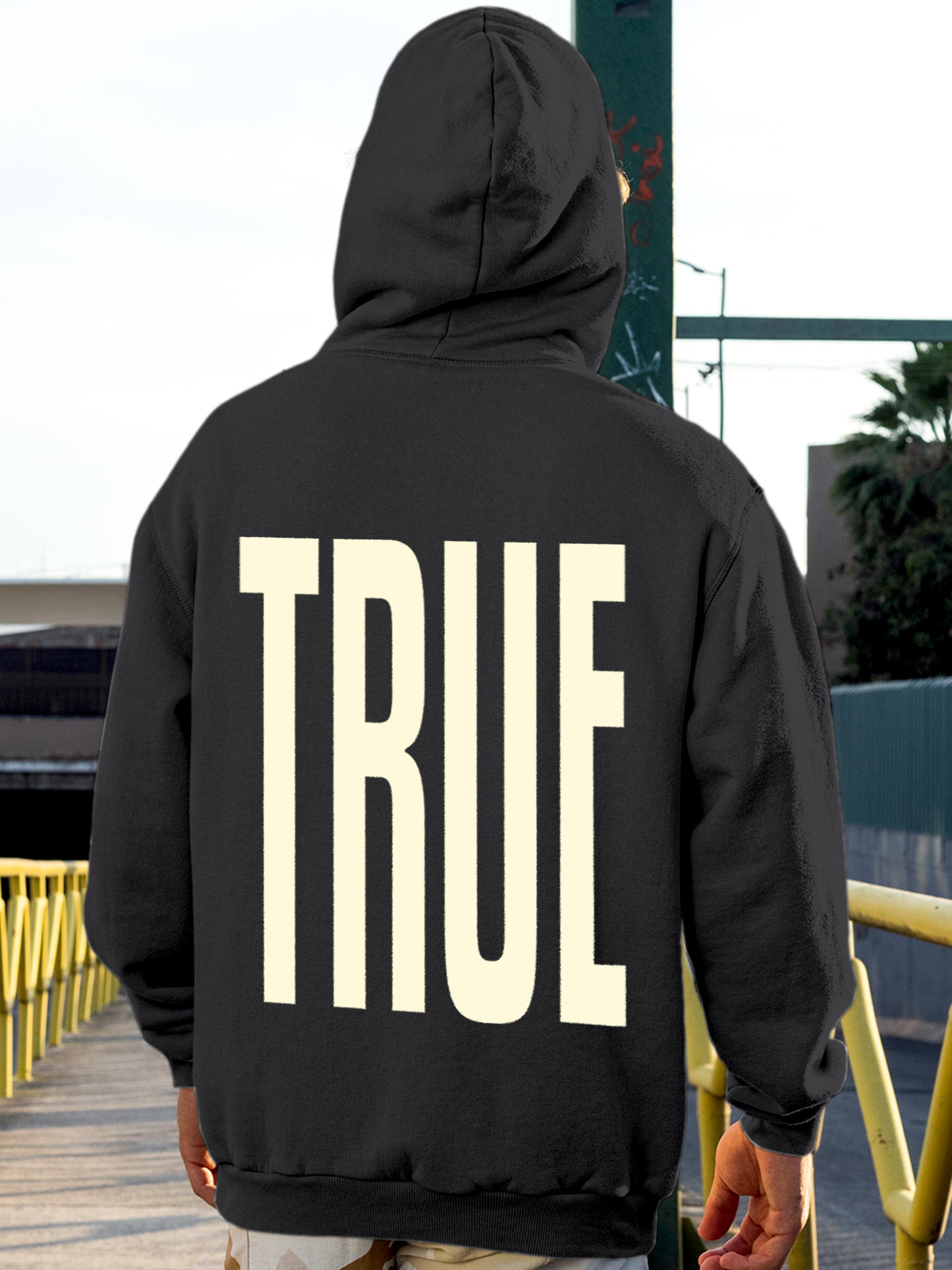 Model wearing Men's Dark Grey Hoodie Sweatshirt with 'Truth' design, offering effortless style and premium comfort
