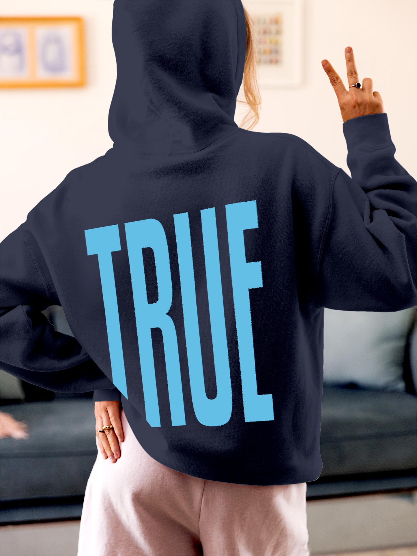 Model wearing Women's Navy Blue Hoodie Sweatshirt with 'Truth' design, offering effortless style and premium comfort