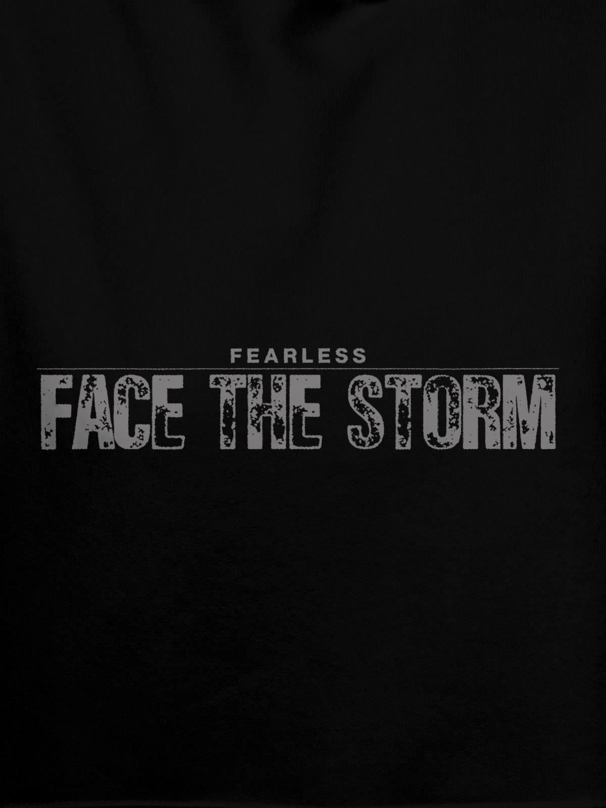 Close up of 'Fearless. Face the Storm' design on Men's Black Hoodie Sweatshirt, highlighting intricate details and vibrant print.