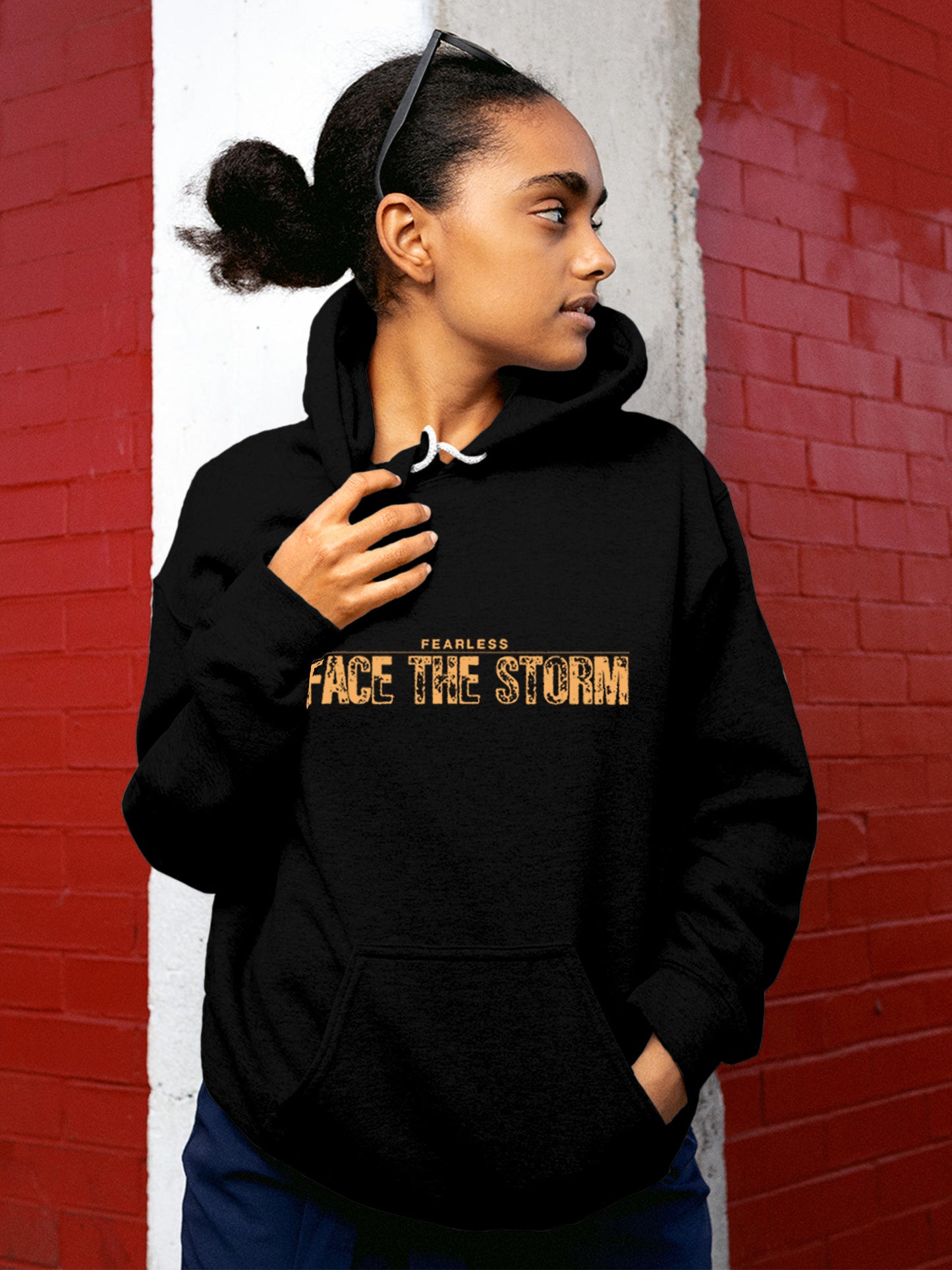 Model wearing Women's Black Hoodie Sweatshirt with 'Fearless. Face the Storm' design, offering effortless style and premium comfort