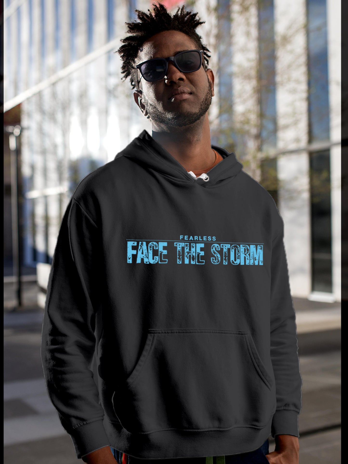 Model wearing Men's Dark Grey Hoodie Sweatshirt with 'Fearless. Face the Storm' design, offering effortless style and premium comfort
