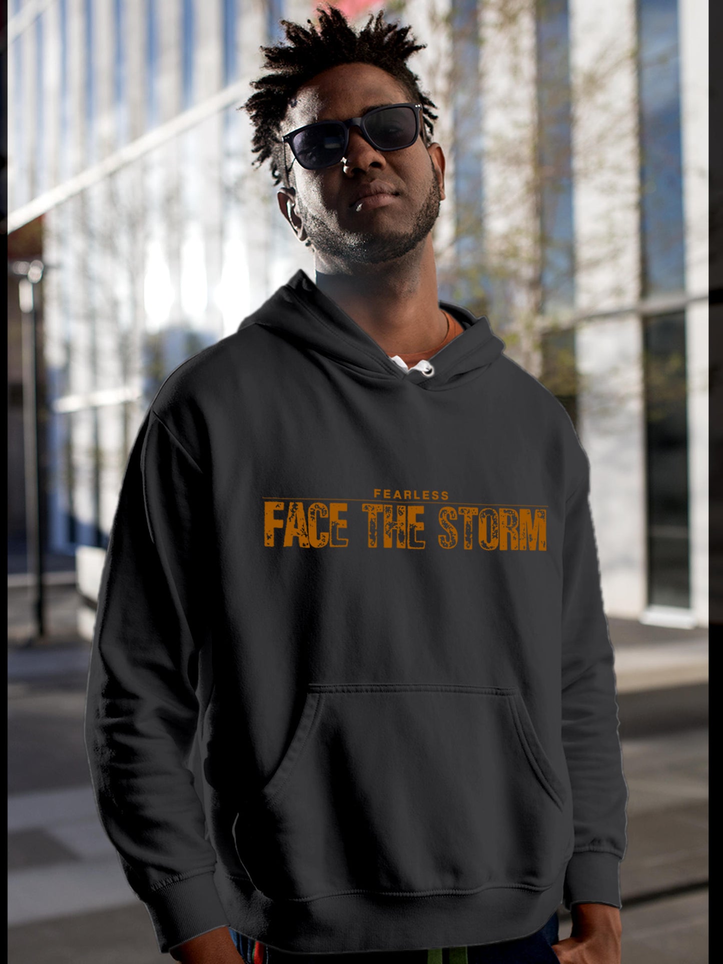 Model wearing Men's Dark Grey Hoodie Sweatshirt with 'Fearless. Face the Storm' design, offering effortless style and premium comfort
