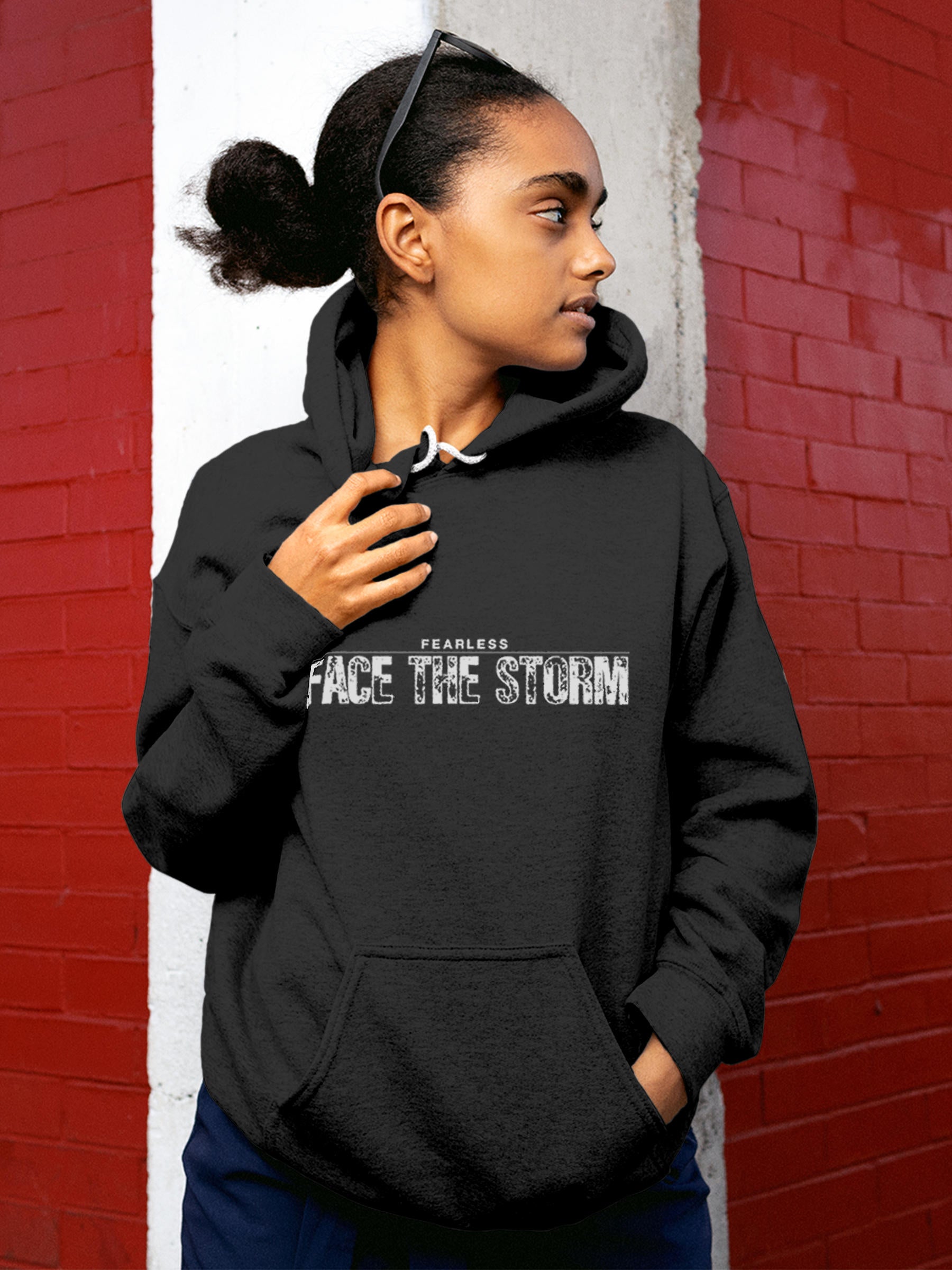 Model wearing Women's Dark Grey Hoodie Sweatshirt with 'Fearless. Face the Storm' design, offering effortless style and premium comfort