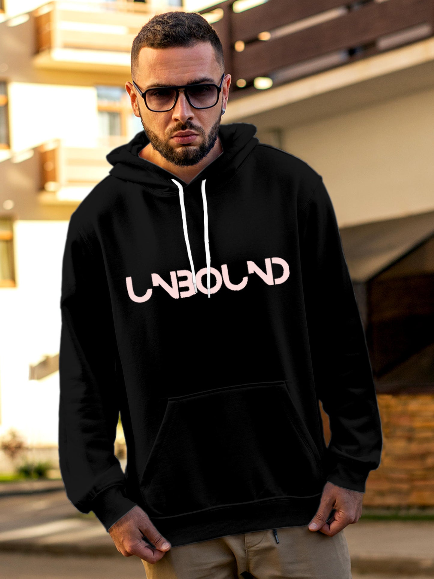 Model wearing Men's Black Hoodie Sweatshirt with 'Unbound' design, offering effortless style and premium comfort
