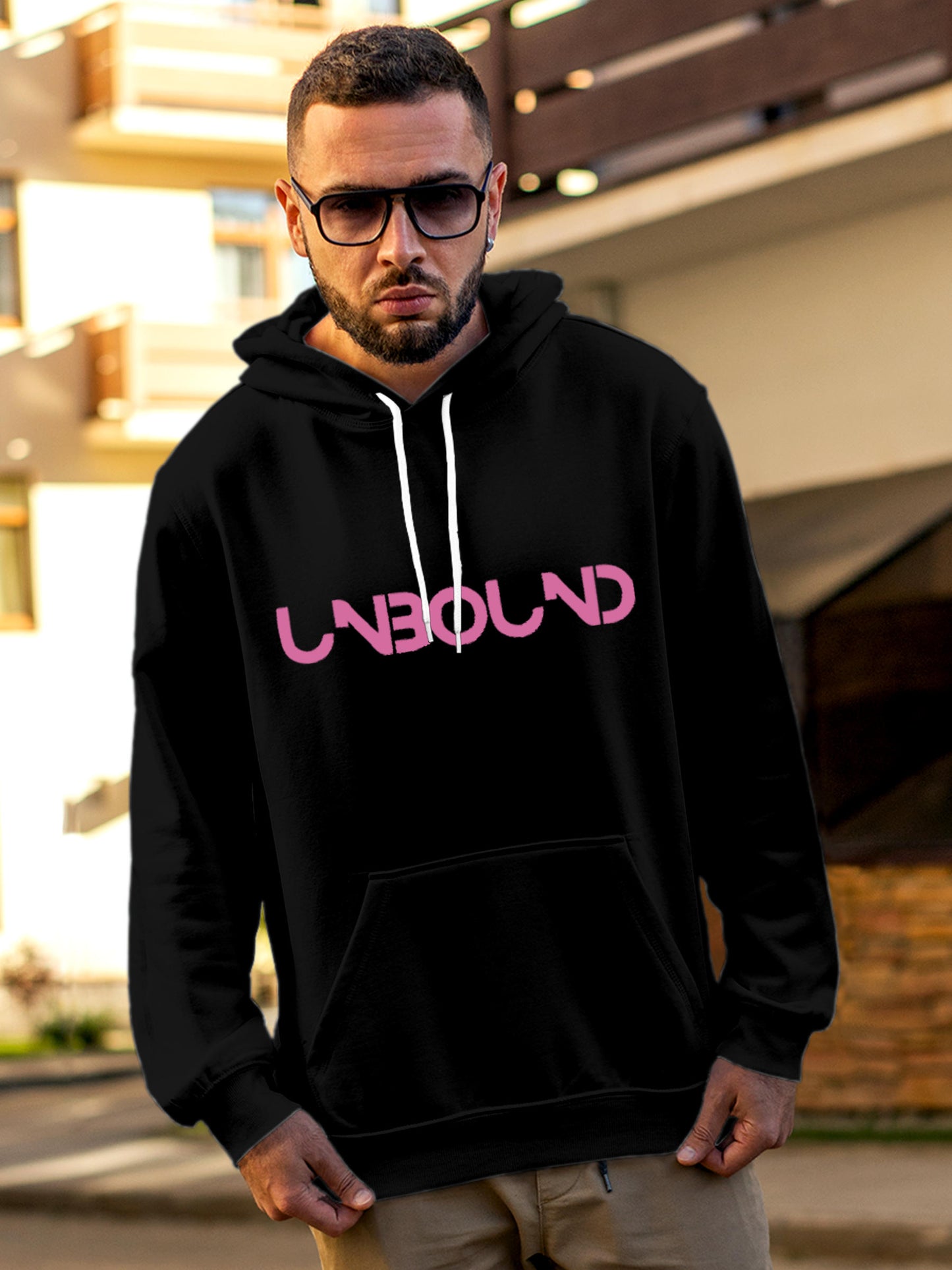 Model wearing Men's Black Hoodie Sweatshirt with 'Unbound' design, offering effortless style and premium comfort