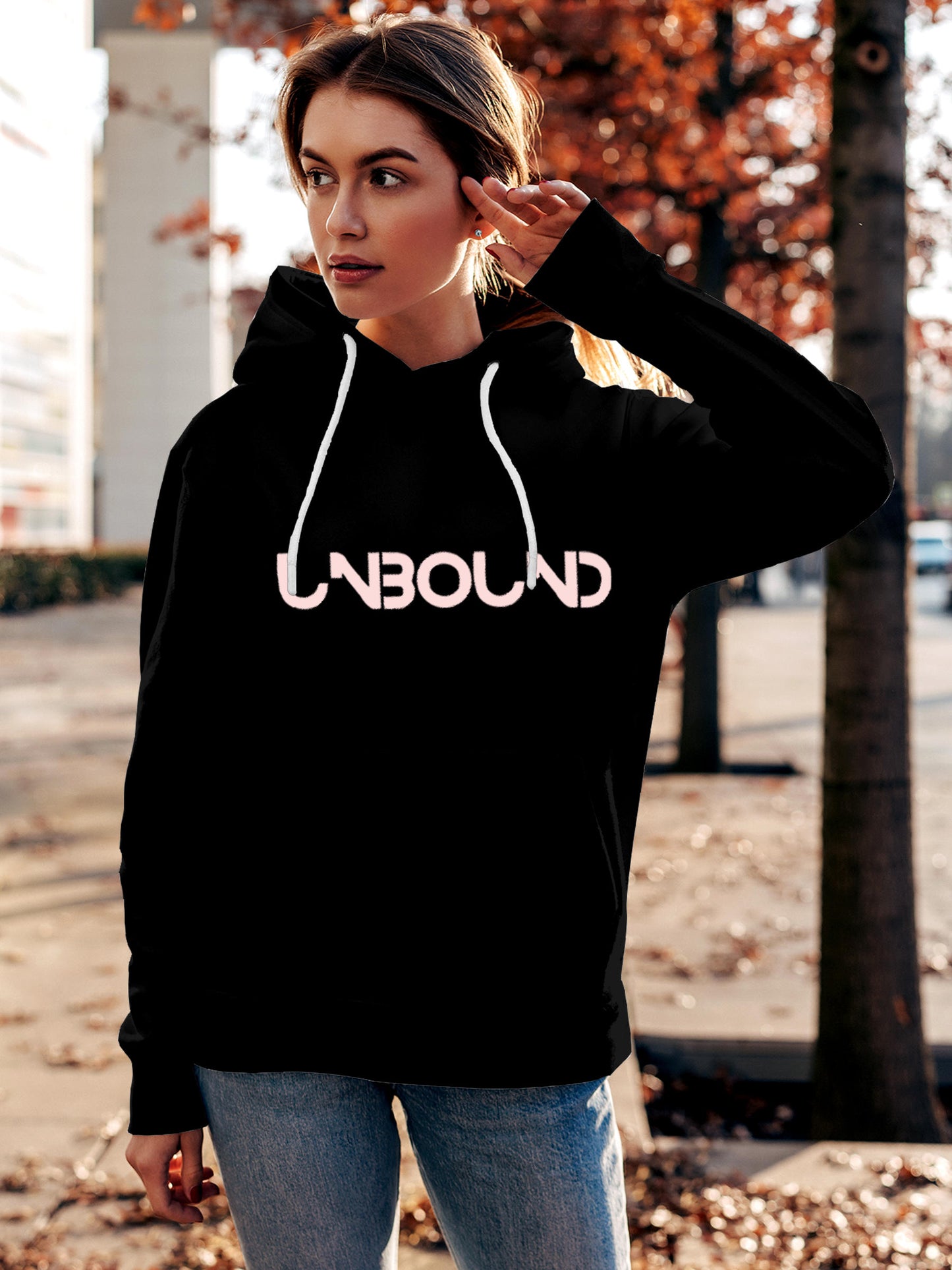 Model wearing Women's Black Hoodie Sweatshirt with 'Unbound' design, offering effortless style and premium comfort