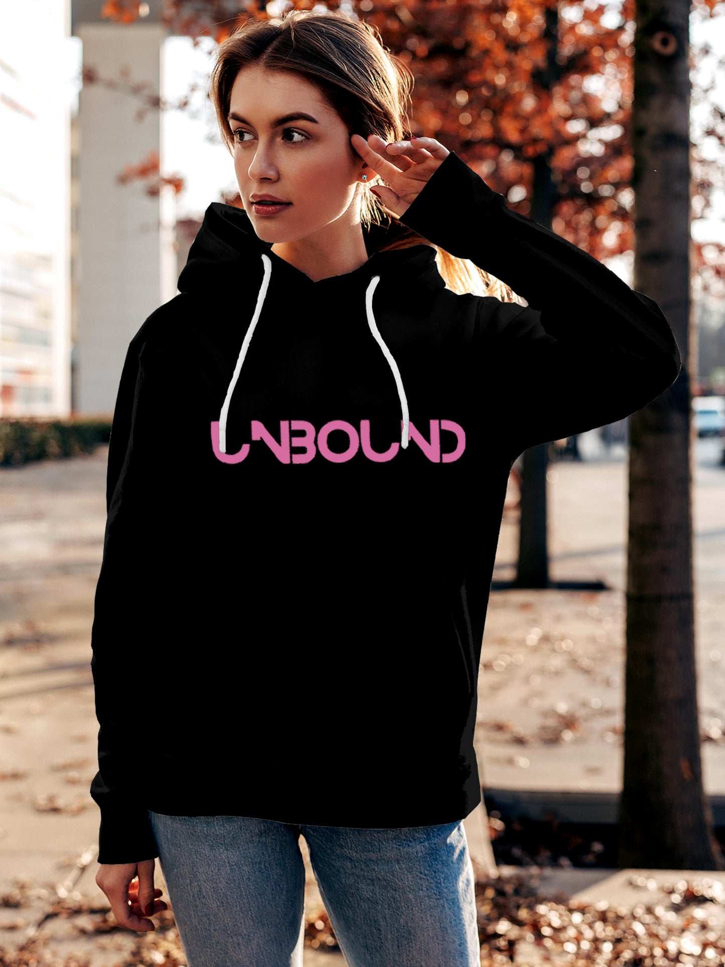 Model wearing Women's Black Hoodie Sweatshirt with 'Unbound' design, offering effortless style and premium comfort