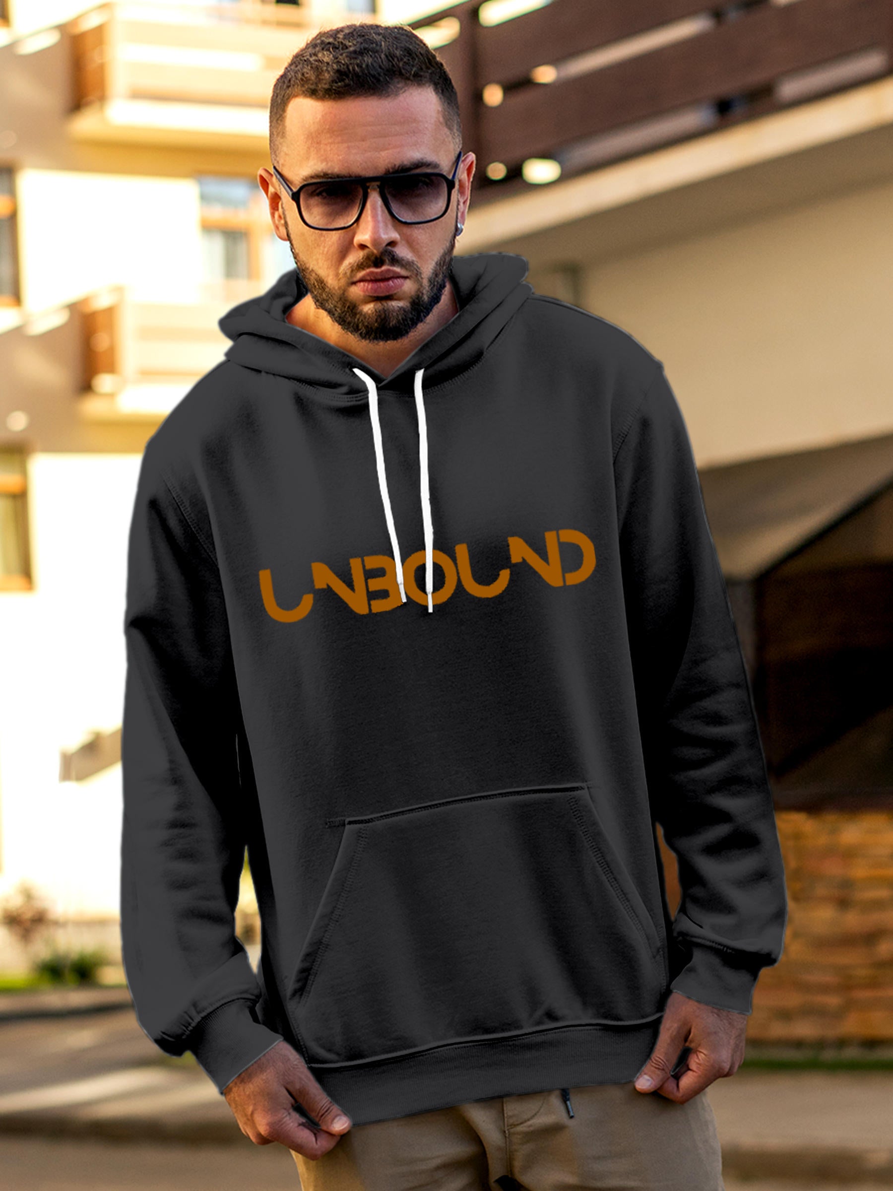 Model wearing Men's Dark Grey Hoodie Sweatshirt with 'Unbound' design, offering effortless style and premium comfort