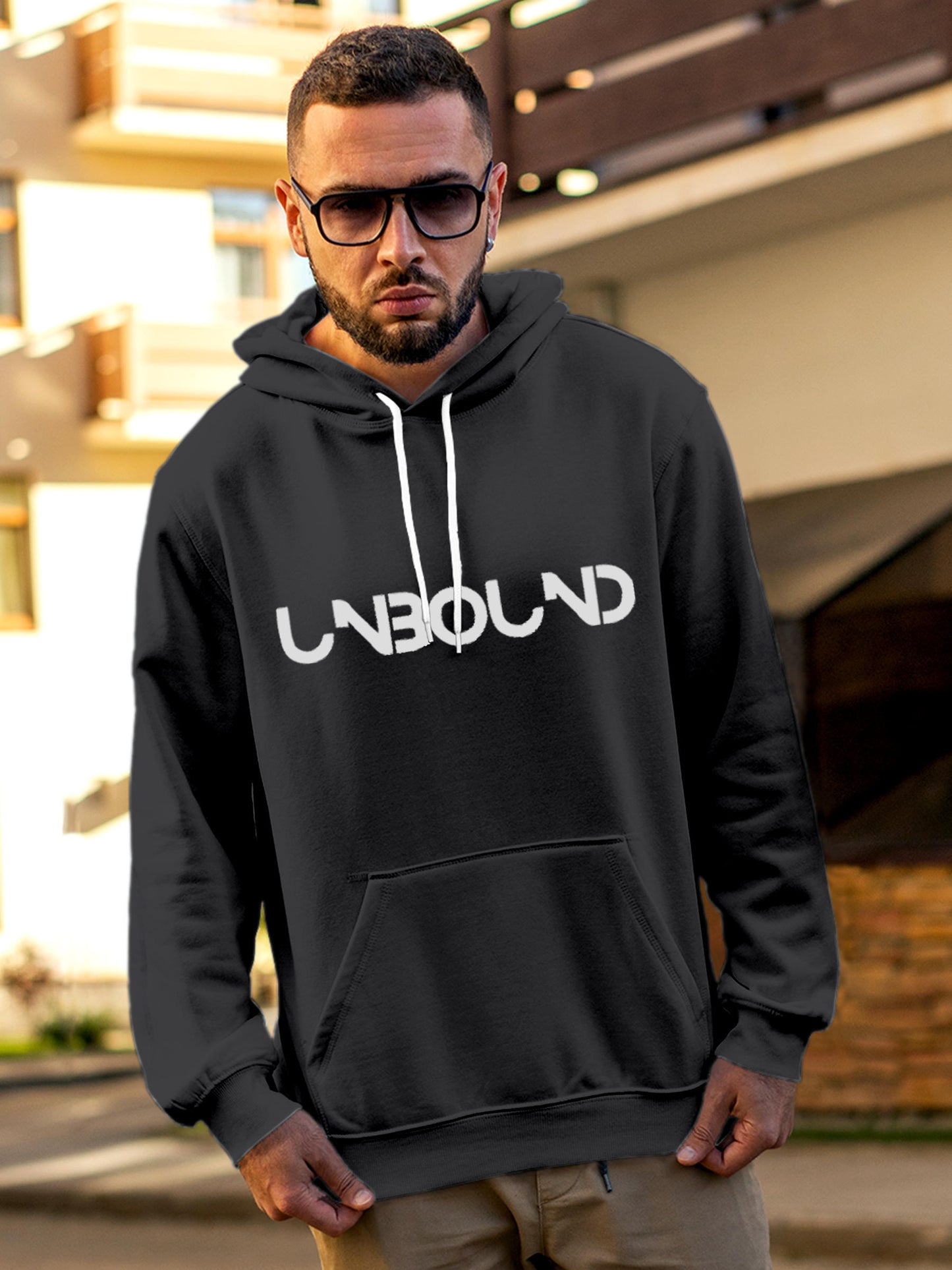 Model wearing Men's Dark Grey Hoodie Sweatshirt with 'Unbound' design, offering effortless style and premium comfort