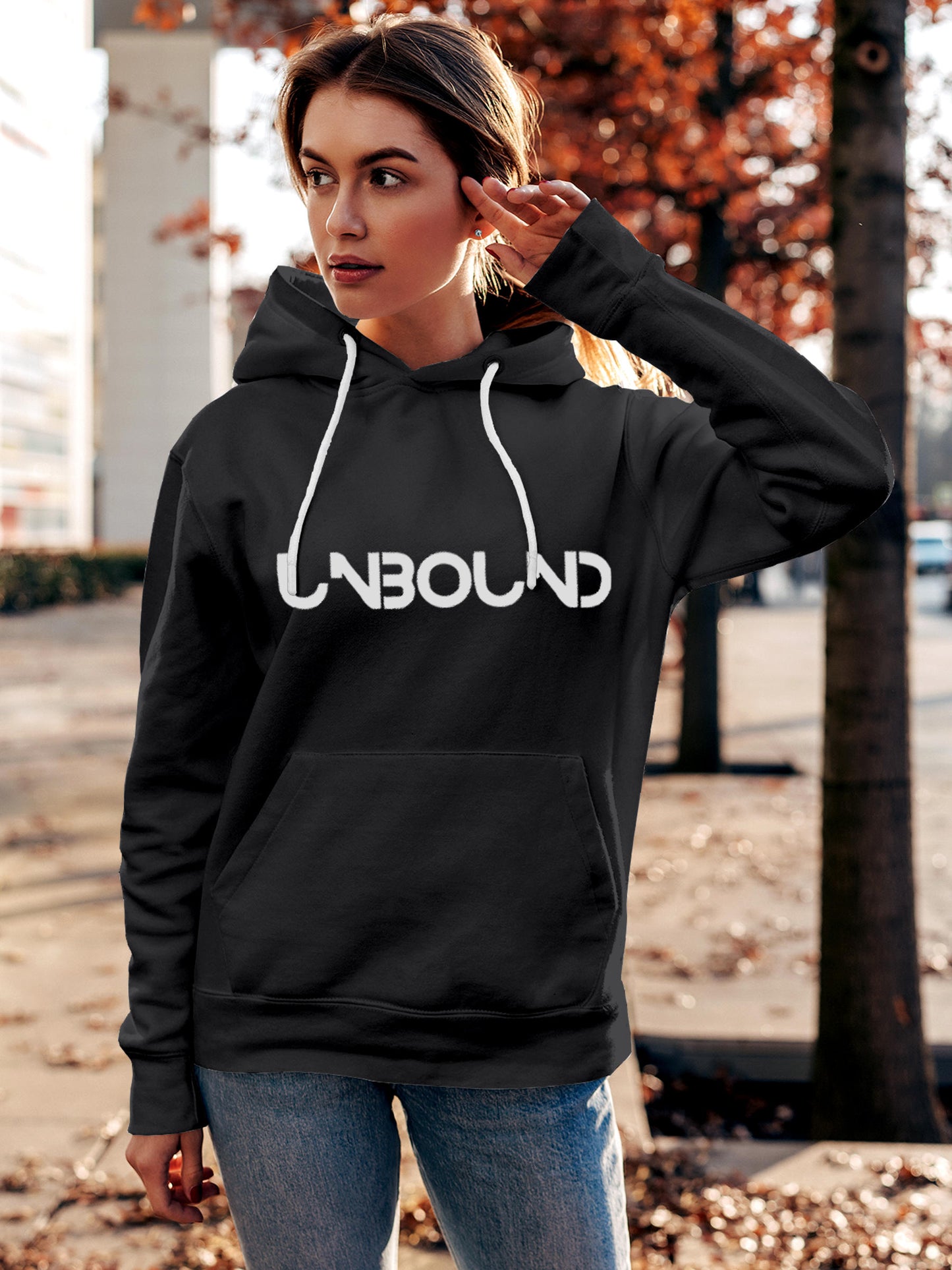 Model wearing Women's Dark Grey Hoodie Sweatshirt with 'Unbound' design, offering effortless style and premium comfort